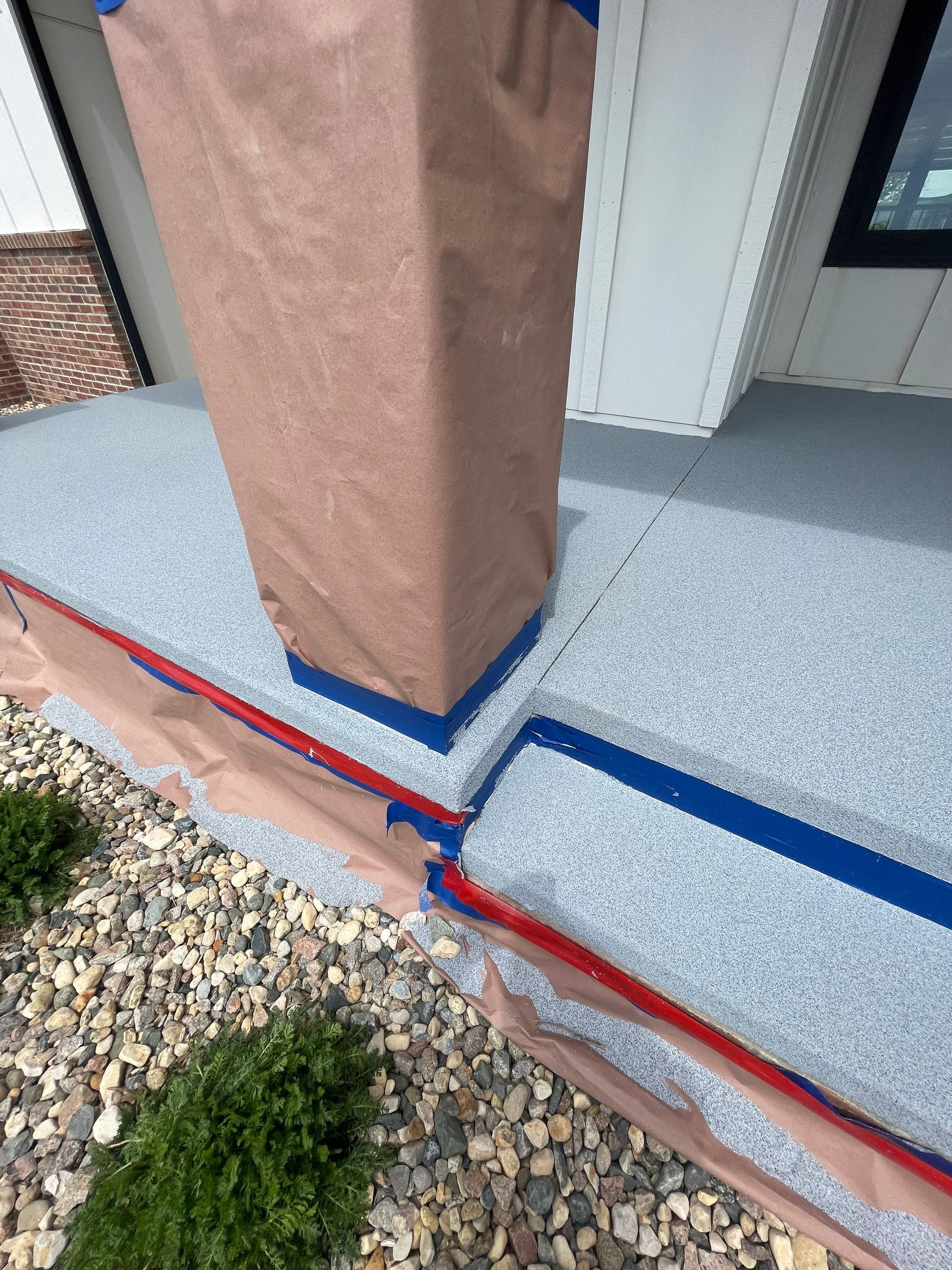 Grey Speckled Concrete Porch Coating for Sioux Falls Home by Select Painting, Coatings & Garage Cabinets