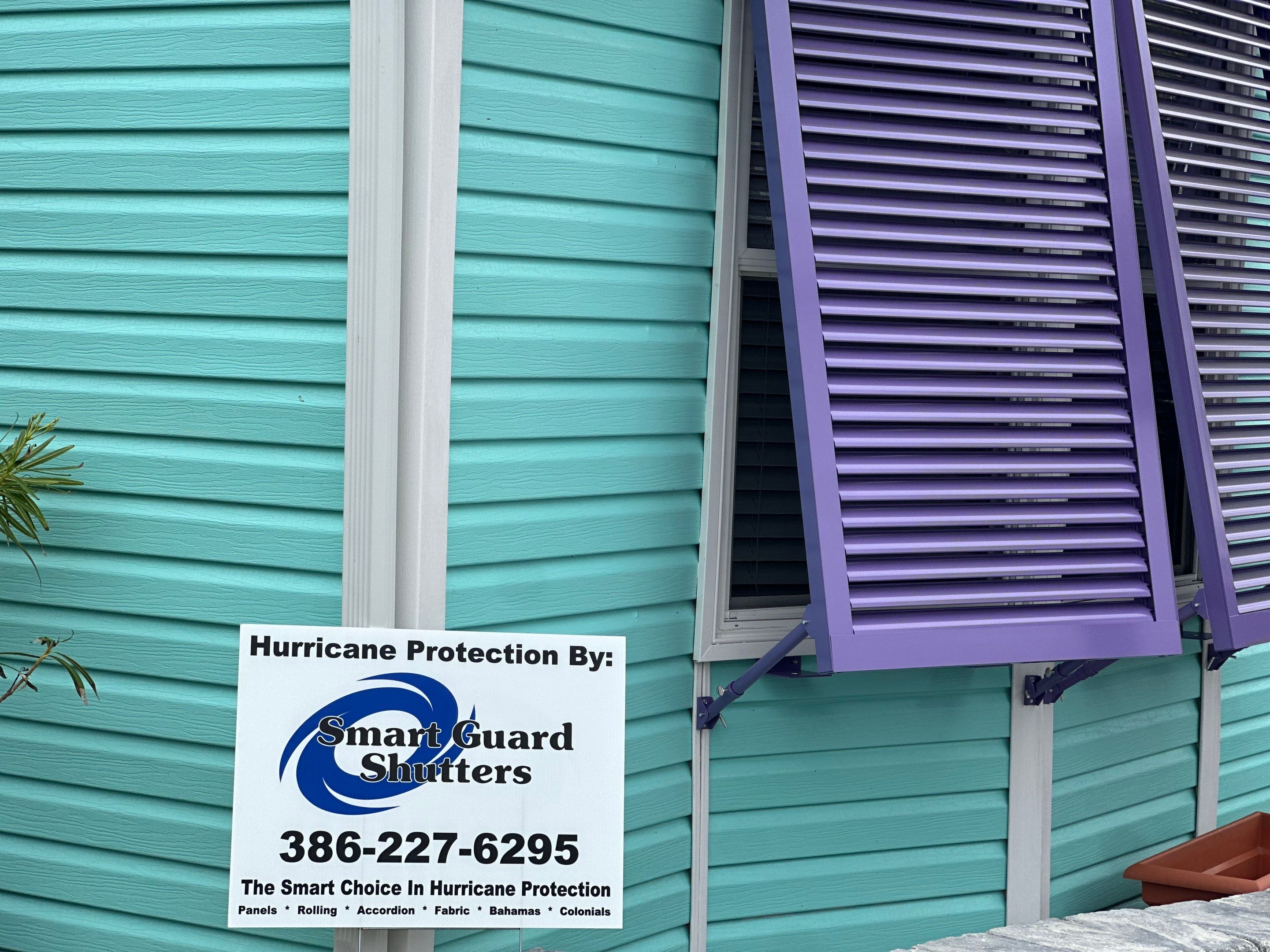 Hurricane Rated Bahama Shutters in Pearl Violet by Smart Guard Shutters