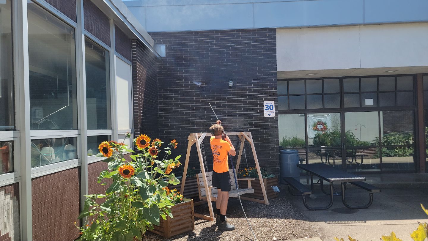 commercial pressure washing using Algaecide, soft wash soap by Northern Power Washing LLC.