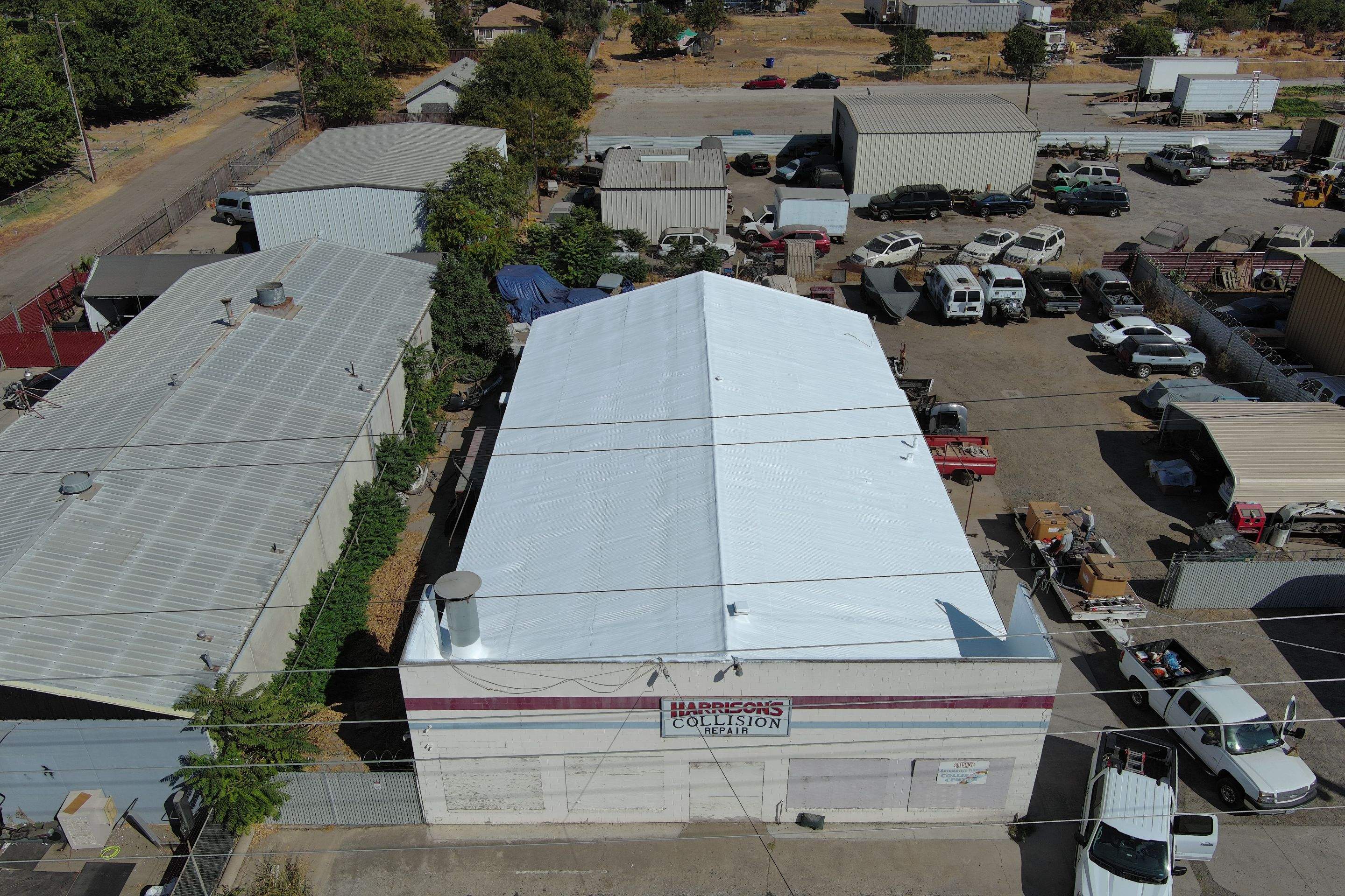 Spray foam and coatings using Conklin Benchmark/ PUMA XL acrylic coatings over metal and foam by Straight Edge Roofing Inc
