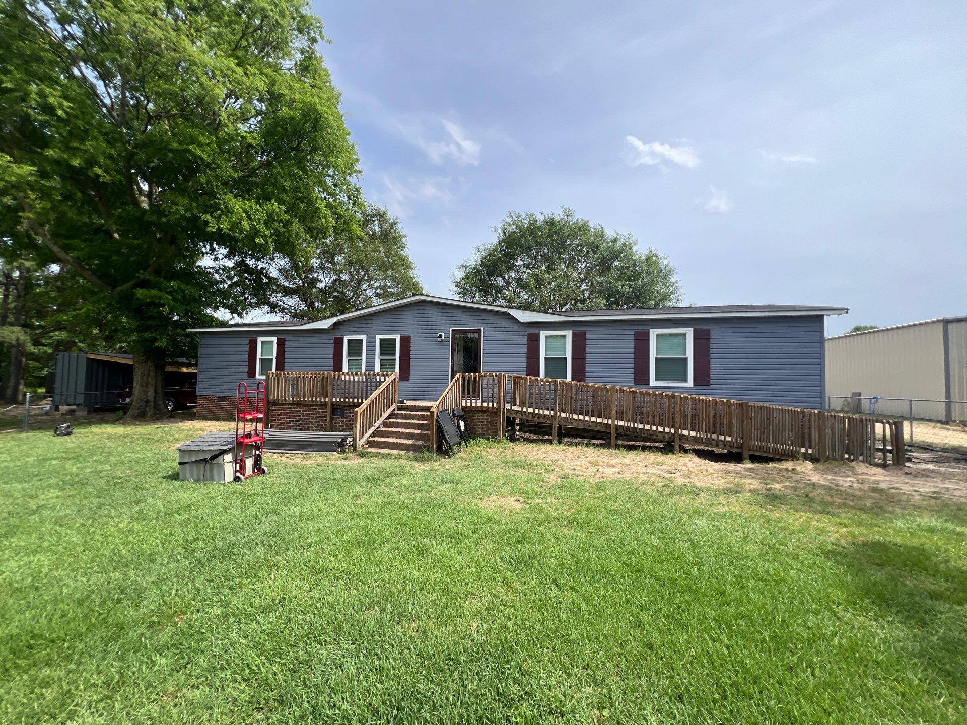 Vinyl Siding and Window Replacement for Goldsboro Modular Home by The Remodeling Company