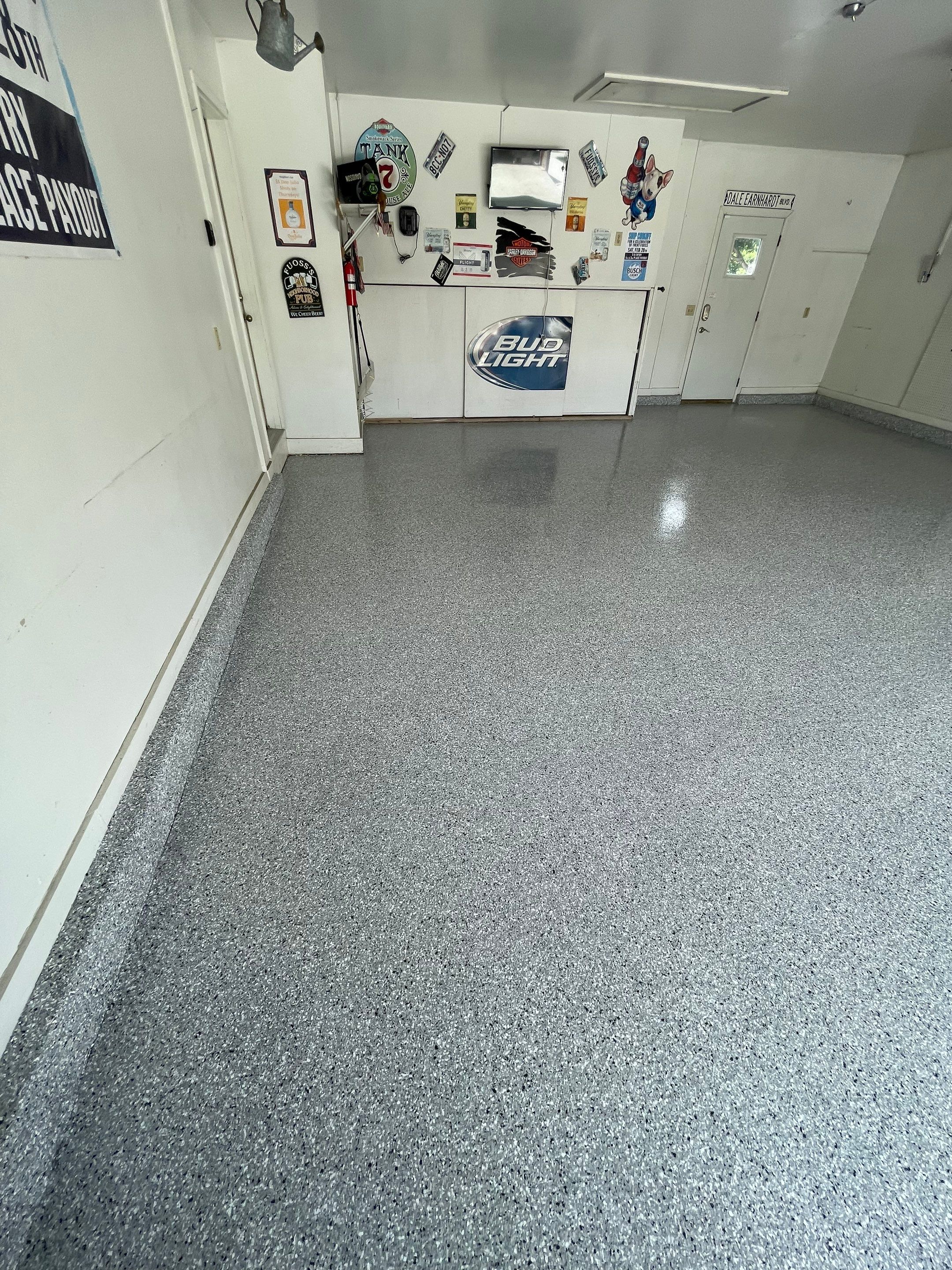 Residential Garage Floor Coating with Feather Grey Finish in Sioux Falls by Select Painting, Coatings & Garage Cabinets