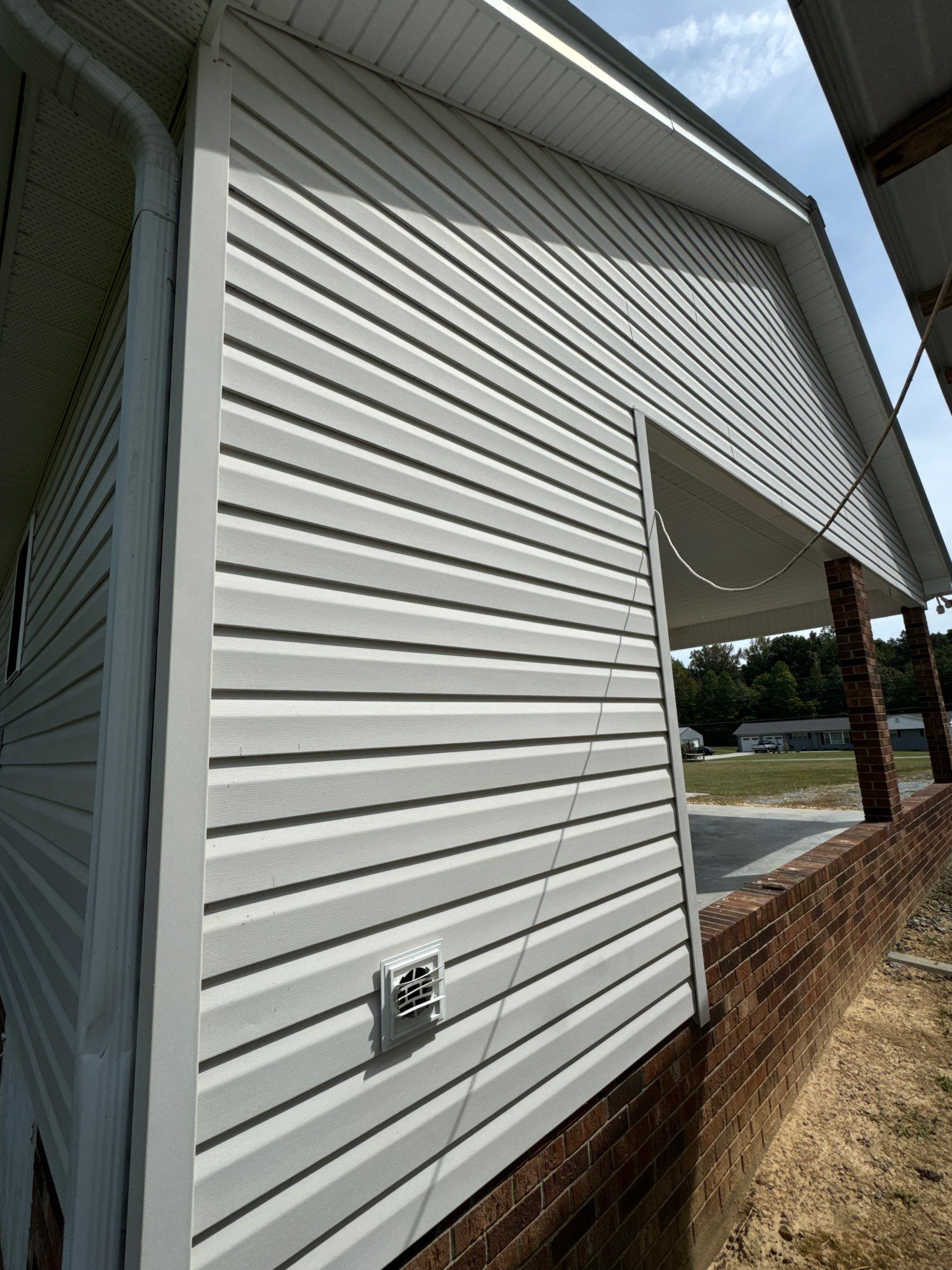 the service shown is cleaning vinyl siding to remove dirt and debris for enhanced appearance and maintenance