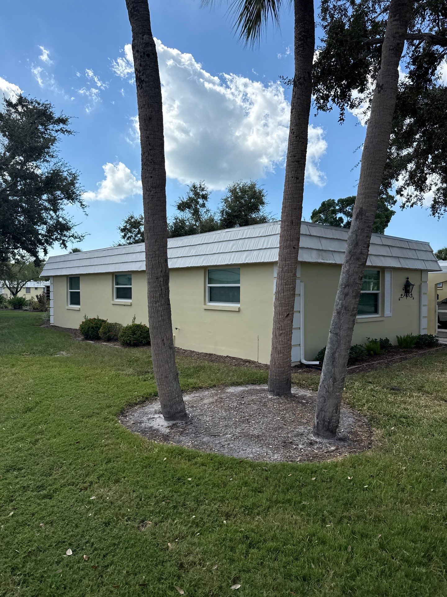 White Gutters and Matching Downspouts in Sarasota FL by Gutter Professors