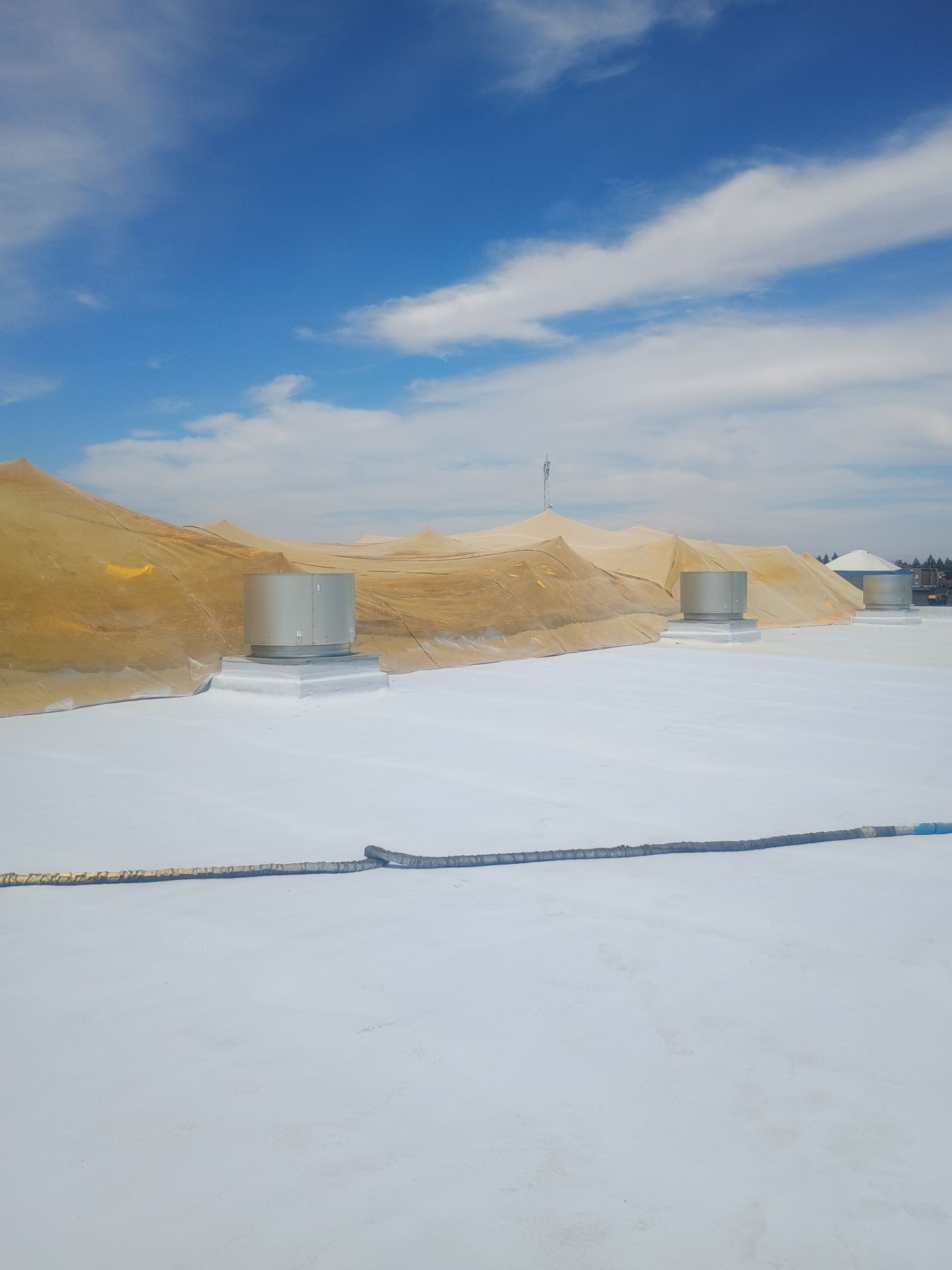 Pro Farms Spray foam roofing project by Straight Edge Roofing Inc