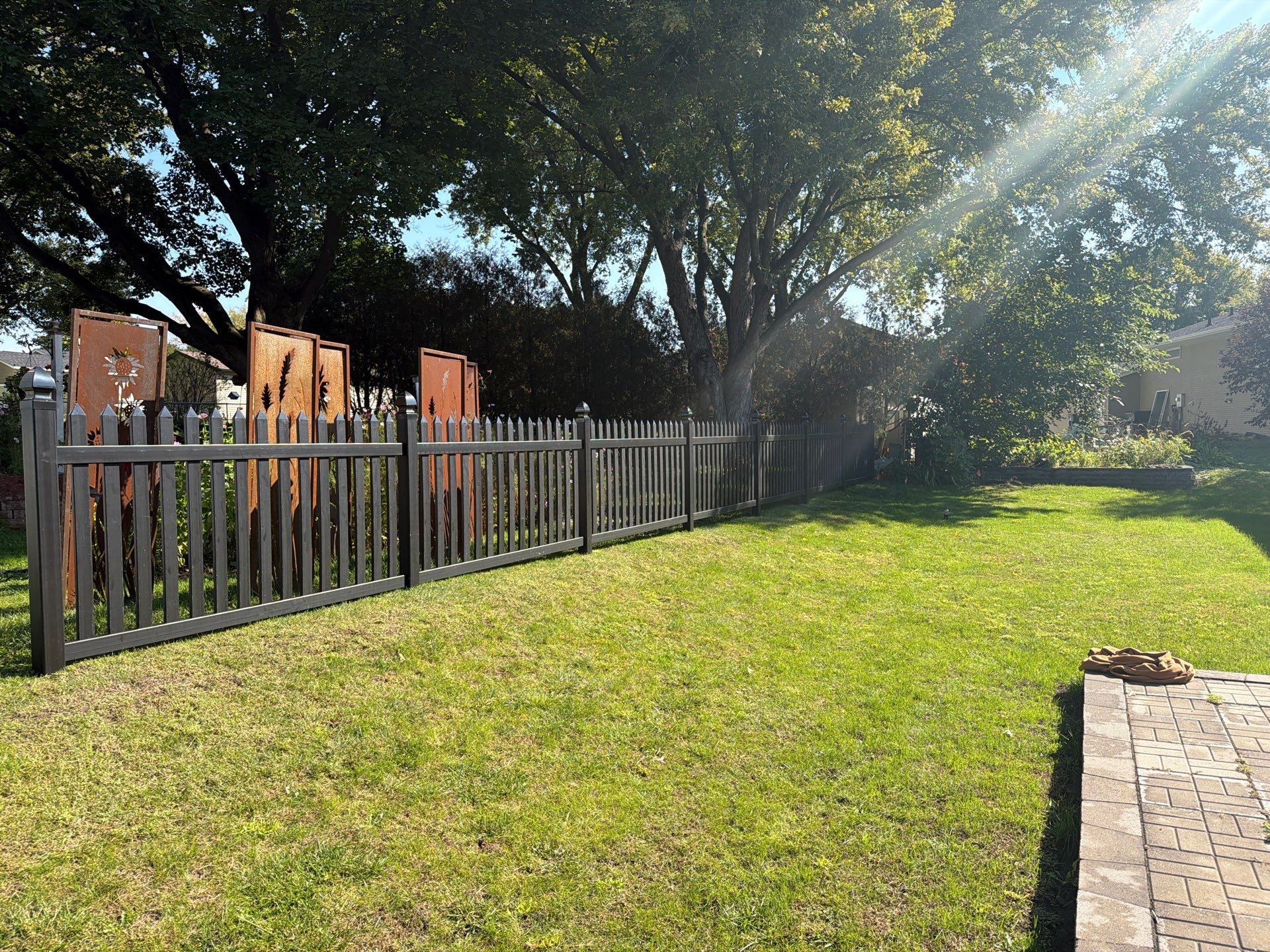 Black Vinyl Spaced Picket Fence Installation in Cedar Falls by Perfect Picket Fence and Stain
