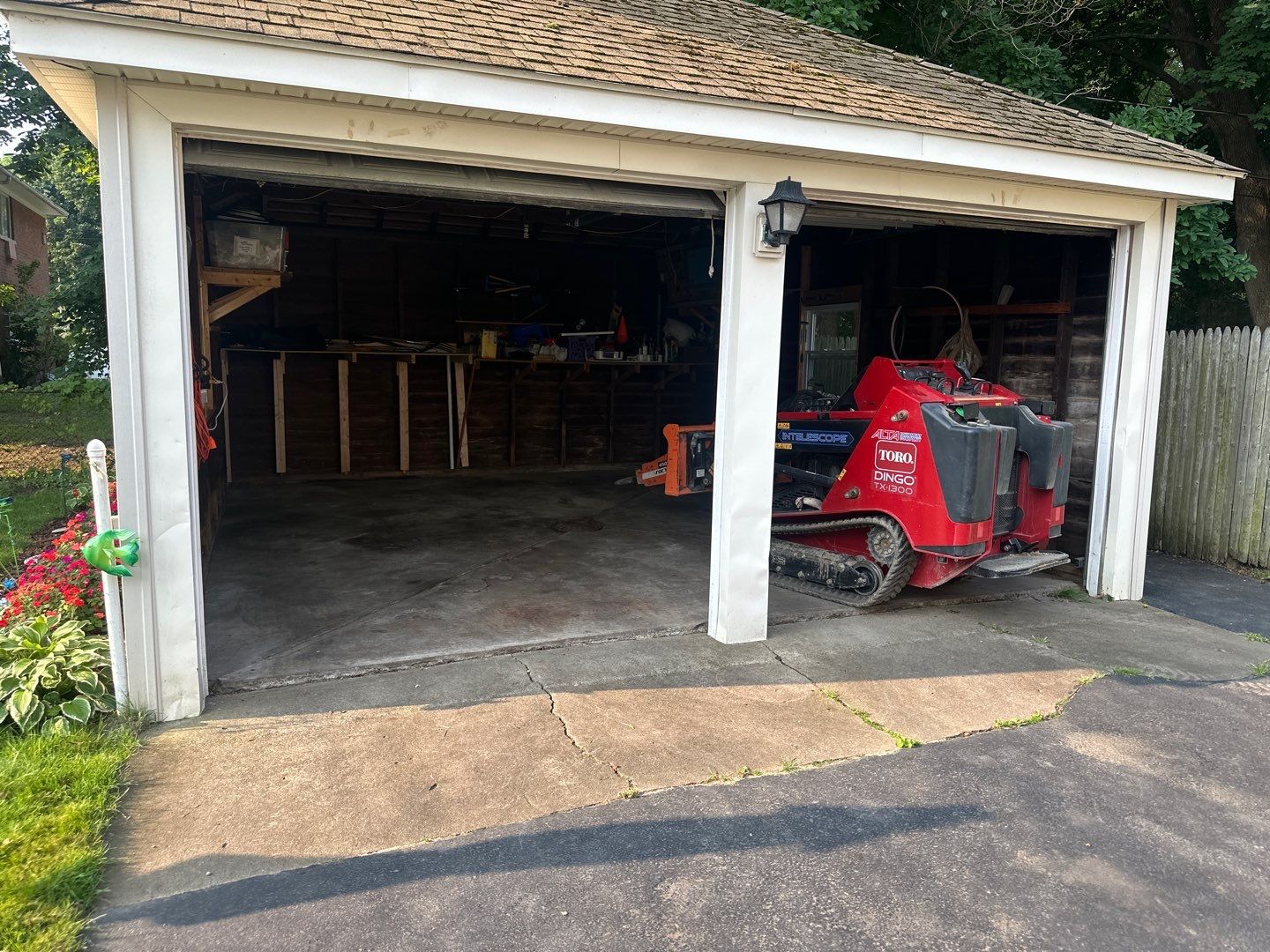 Concrete garage floor replacement with a broom finished apron by NG Masonry & Construction LLC