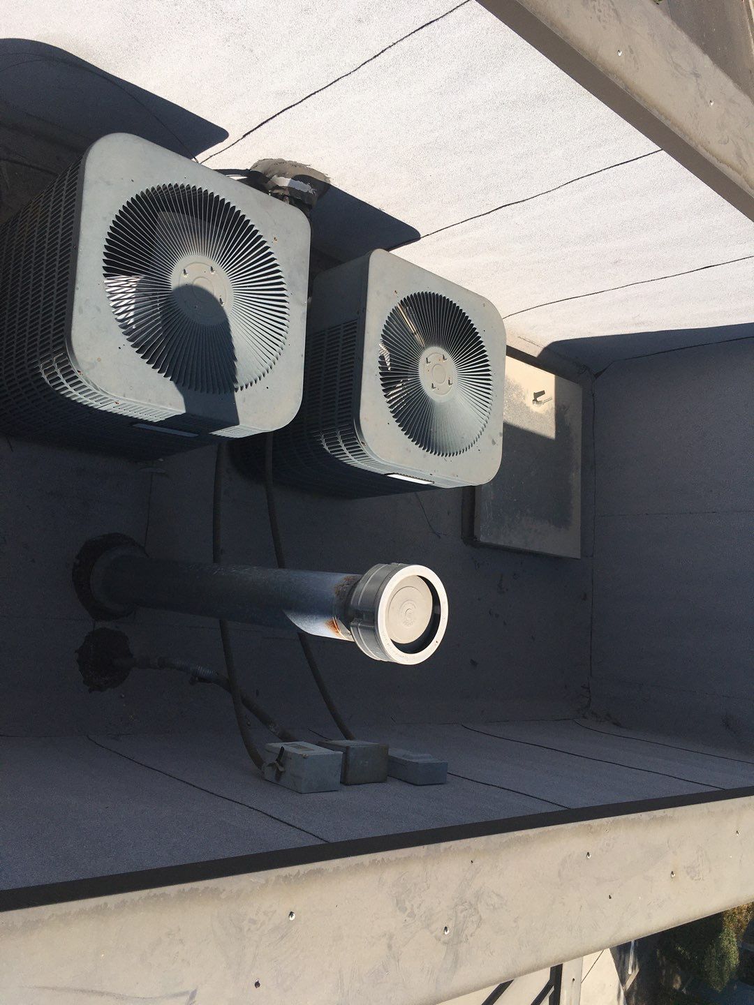 Spray foam and coatings inside commercial building HVAC well using Spray foam and coatings over existing BUR system by Straight Edge Roofing Inc
