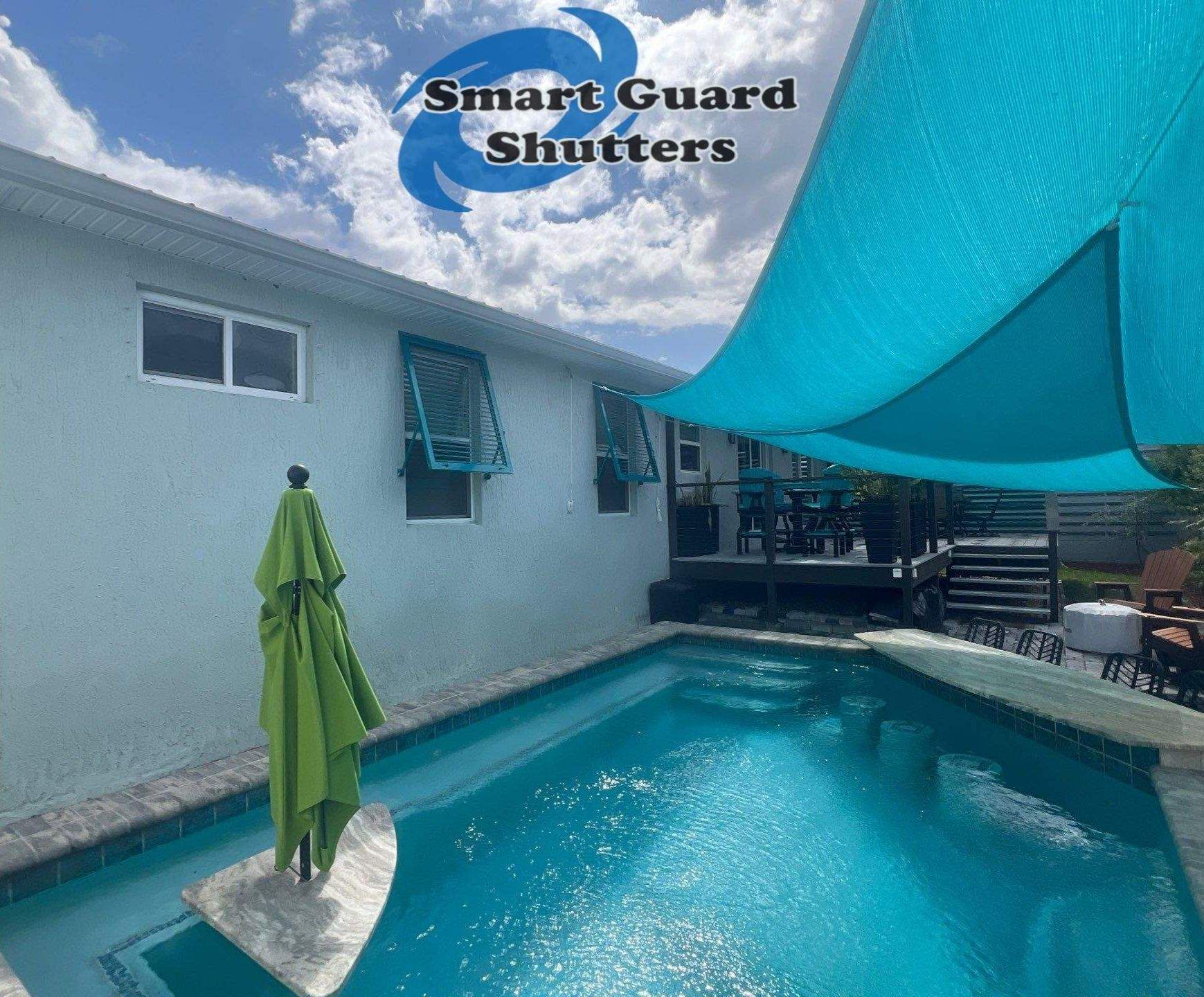 Impact Bahama Shutters in Water Blue by Smart Guard Shutters