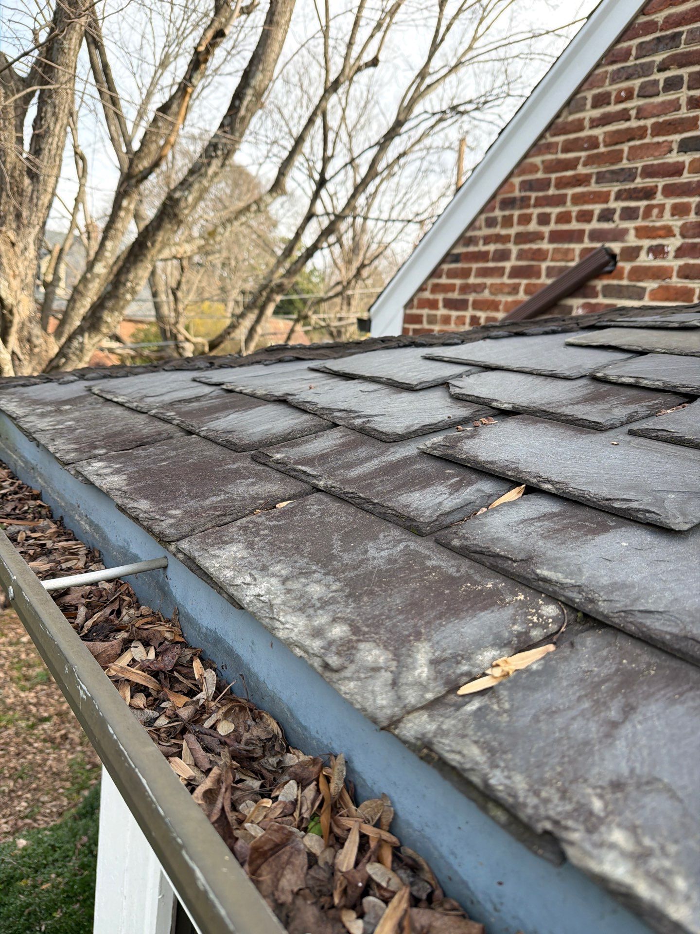 Slate Roof Restoration and Copper Ridge Cap Install in Richmond by Cade Construction