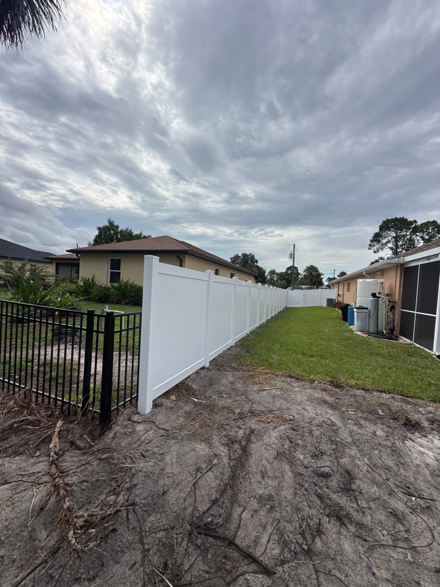 White Vinyl Privacy Fence Installation in North Port Florida by True Fence LLC