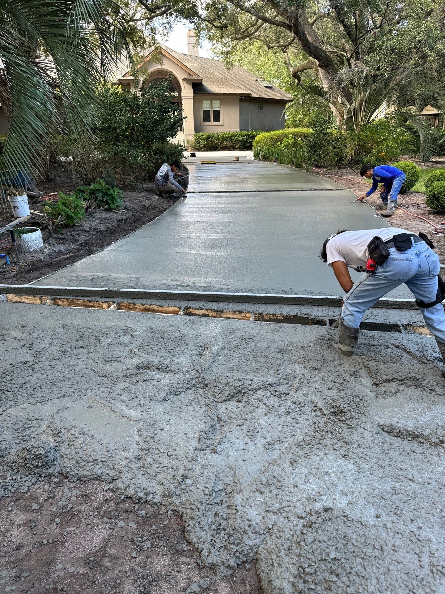 Custom Concrete Driveway with Decorative Paver Inlays in Hilton Head Island by Lowcountry Scapes, LLC