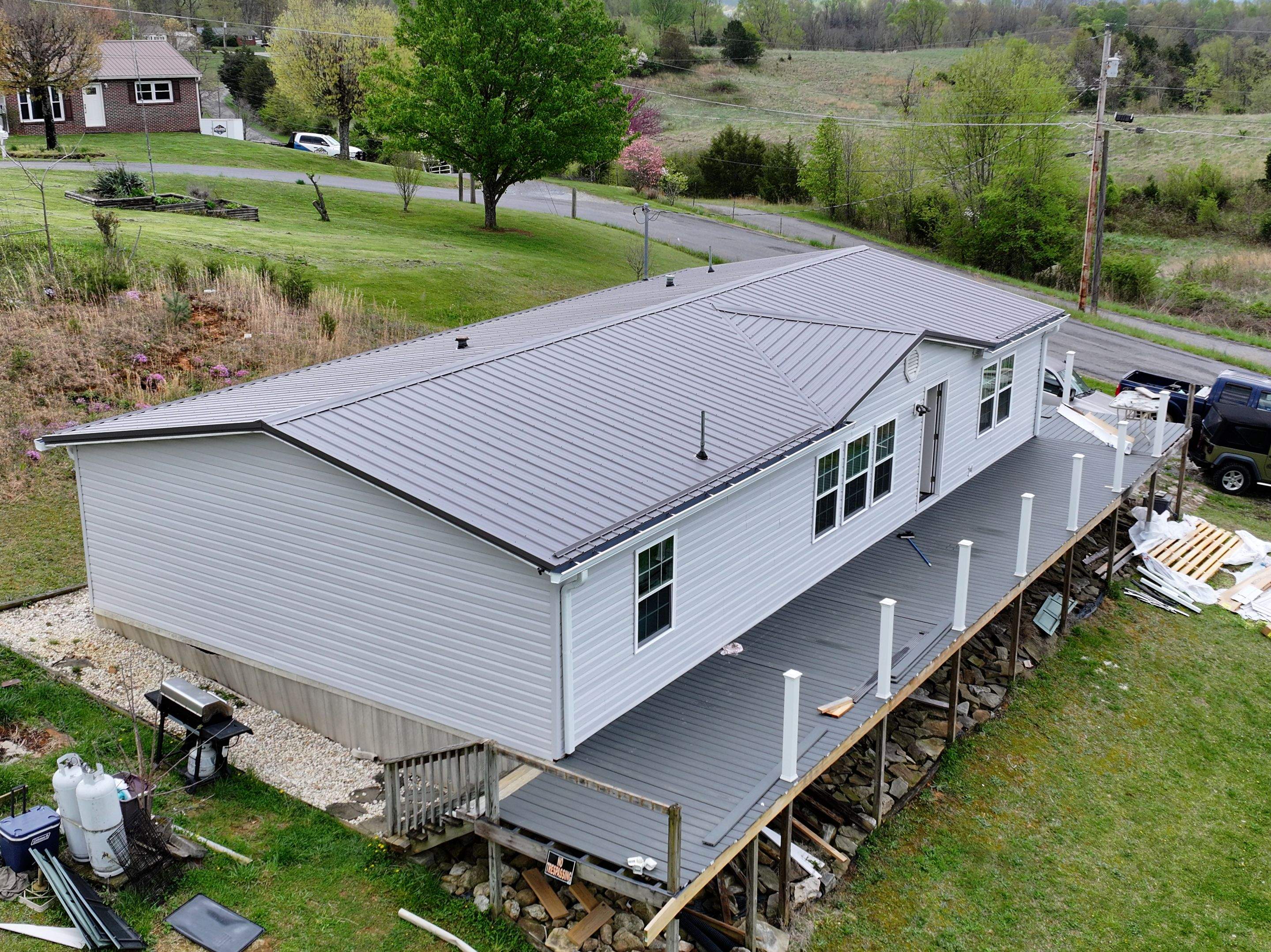 Charcoal Gray Textured Metal Roof by Omnia Roofing