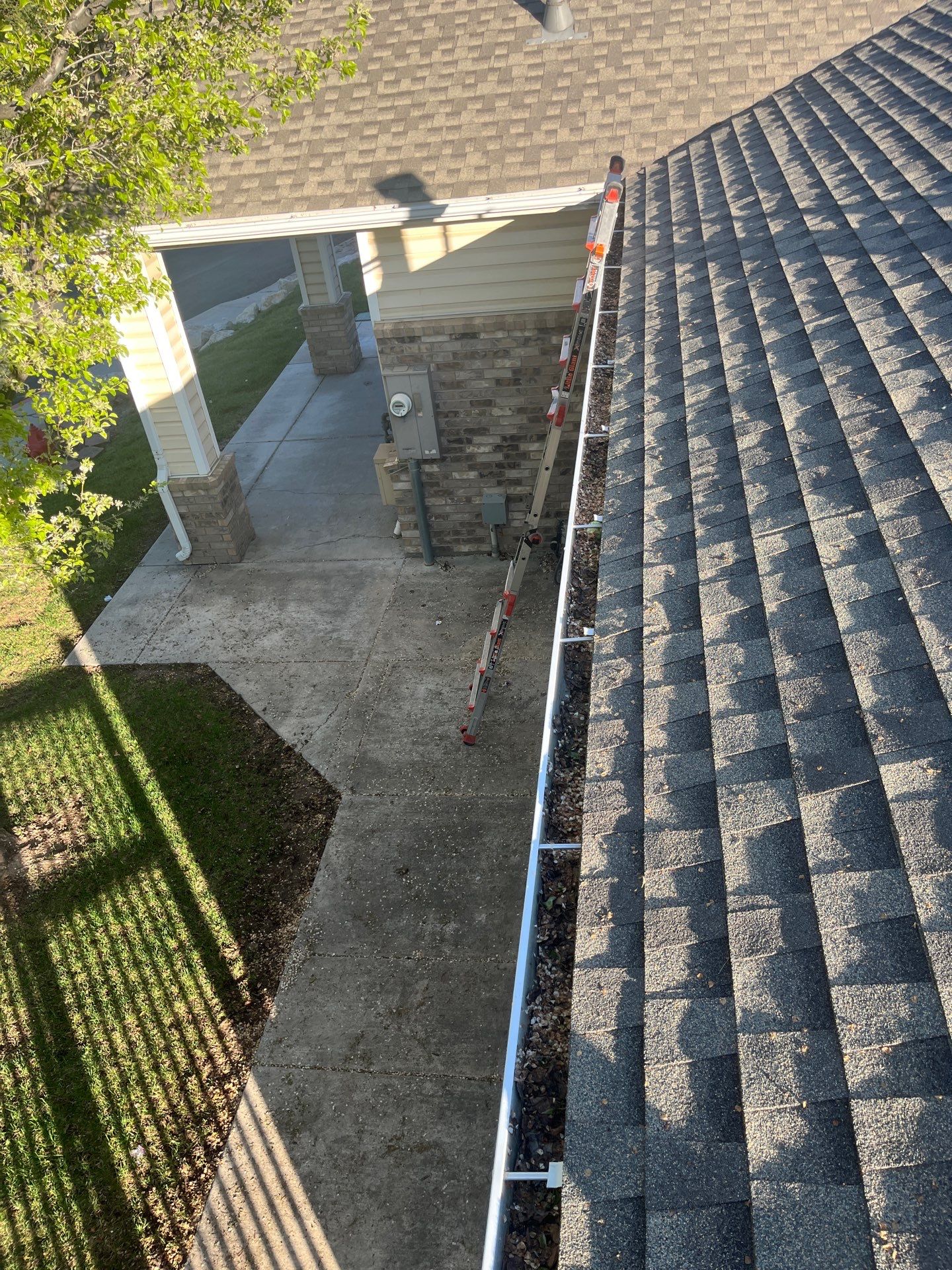 Commercial gutter cleaning Ogden, UT before photo with filled gutters
