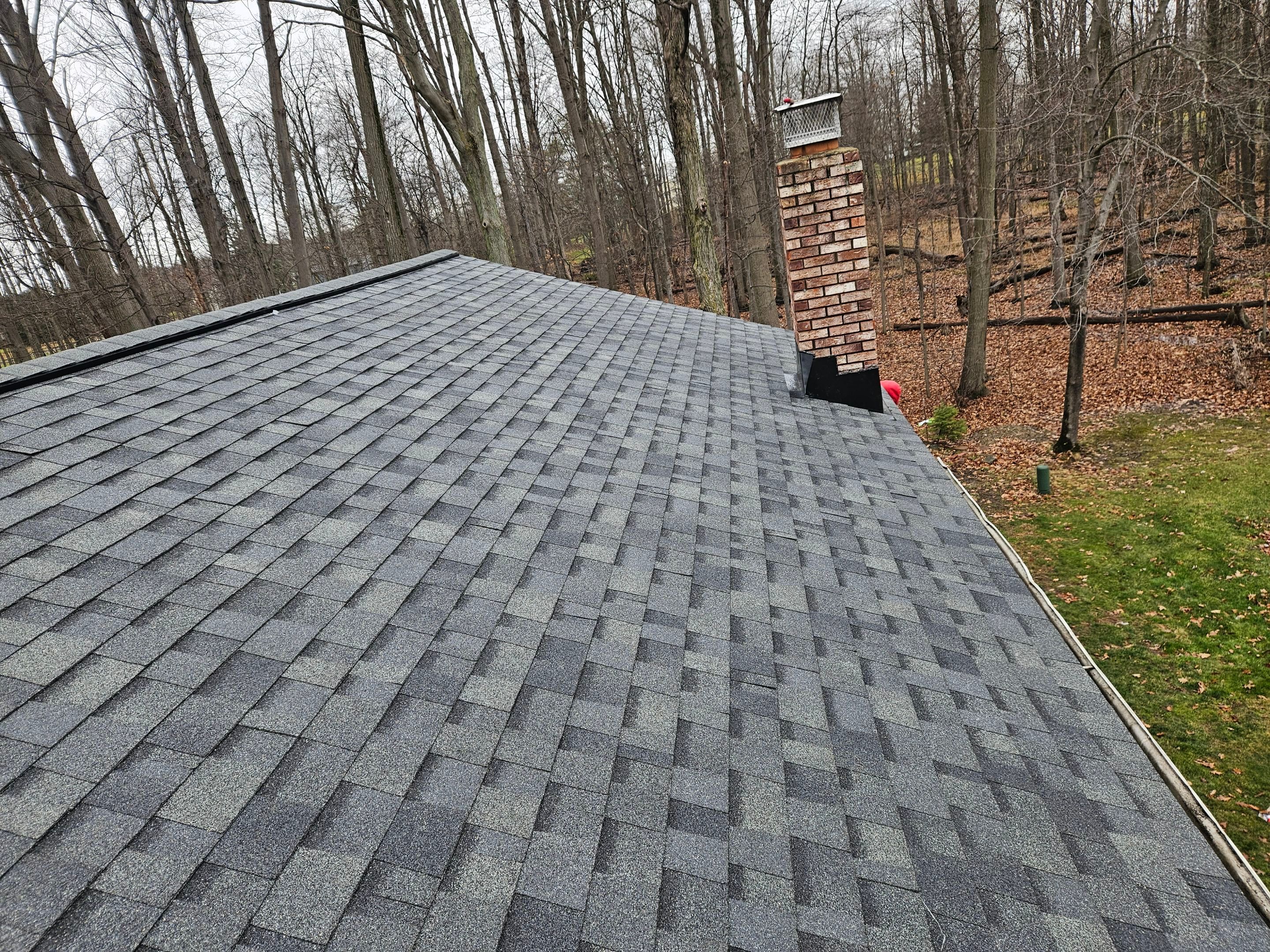 Residential Roof Replacement using Owens Corning Onyx Black by Absolute Roofing and Construction
