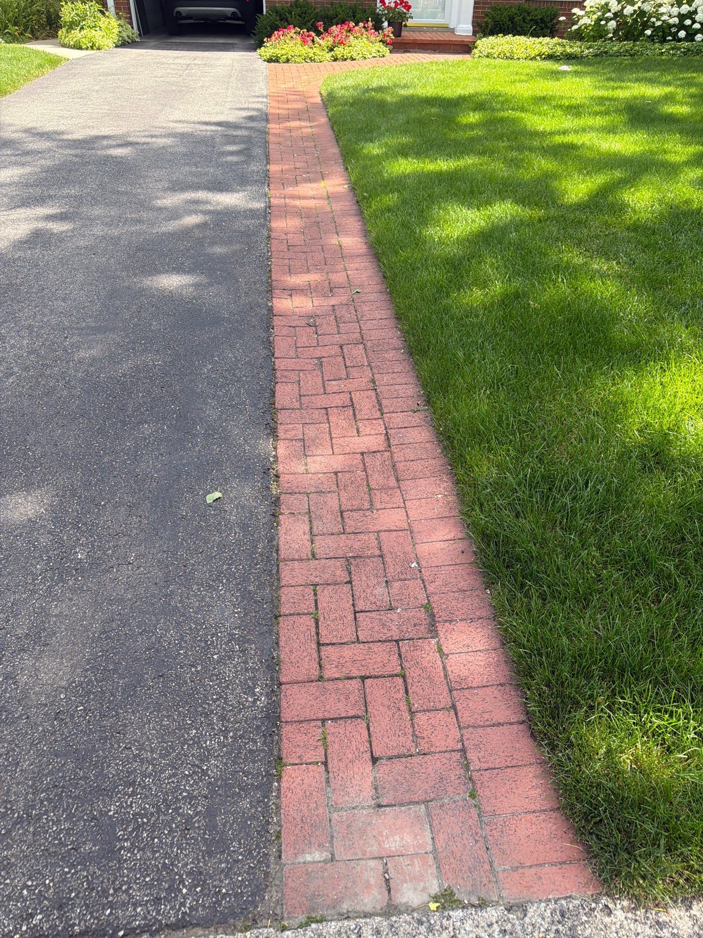 Brick Paver cleaning, sanding, seal by Northern Power Washing LLC.