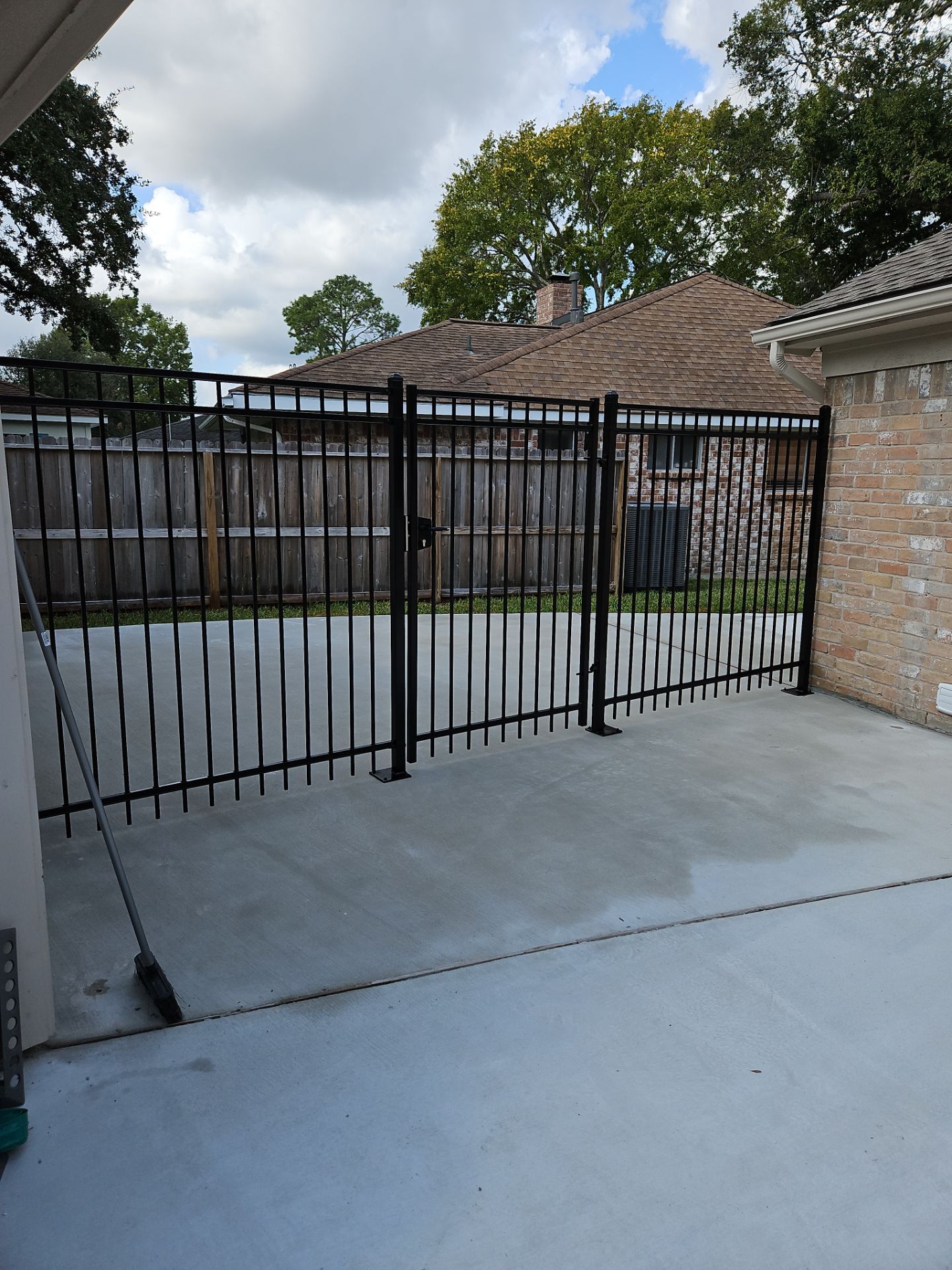 Iron fence installation using 6ft - 3 Rail - Ameristar Montage by Tim's Fences