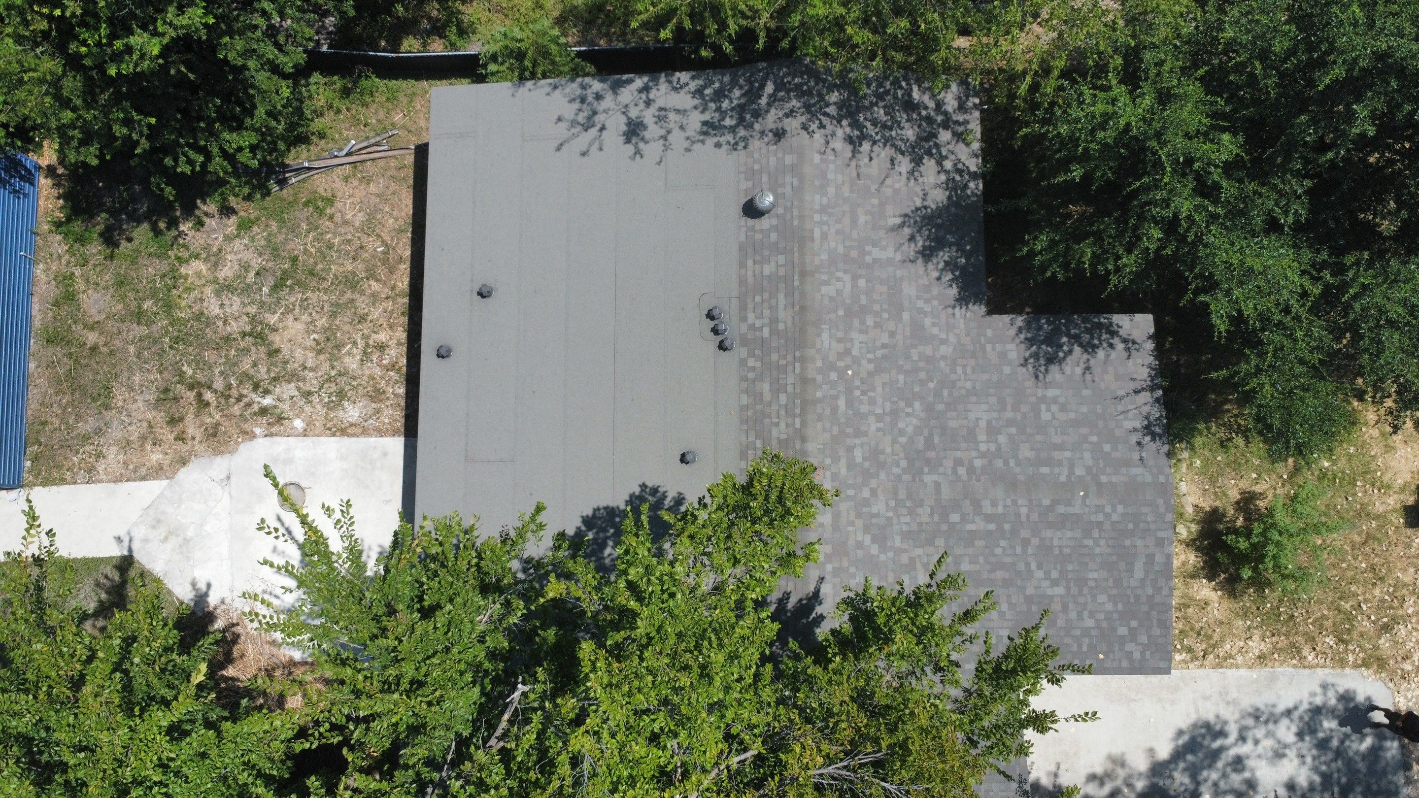 Mixed Roof System ā Oakridge Driftwood + Flat Roof Section | Austin, TX by Kstylez Roofing & Construction