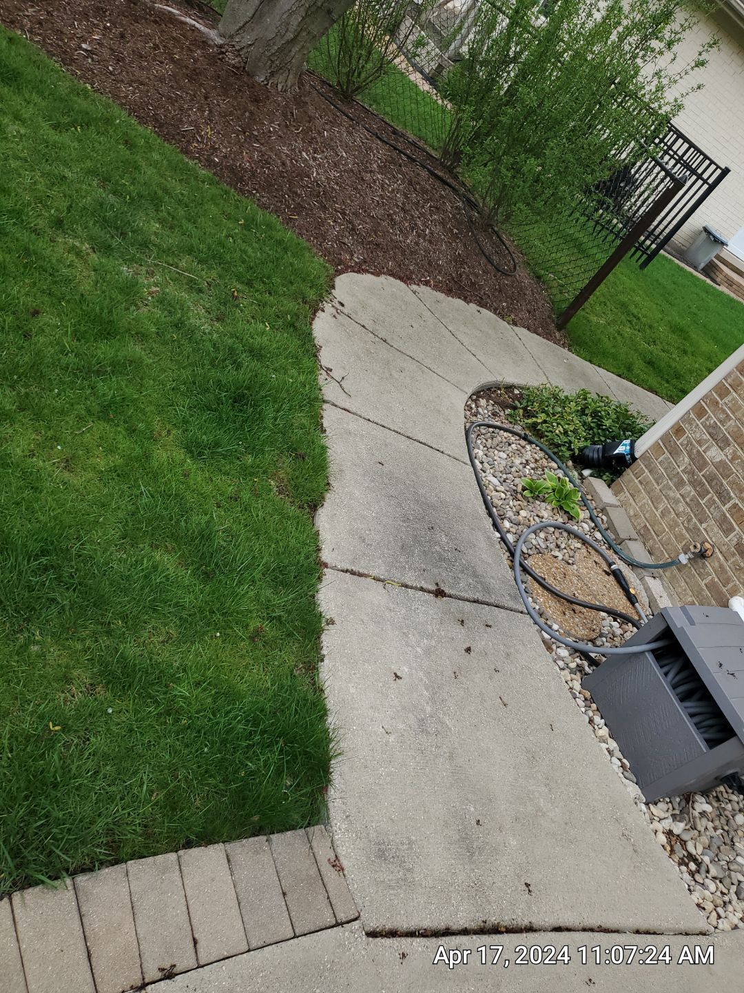 concrete patio and driveway cleaning by Northern Power Washing LLC.