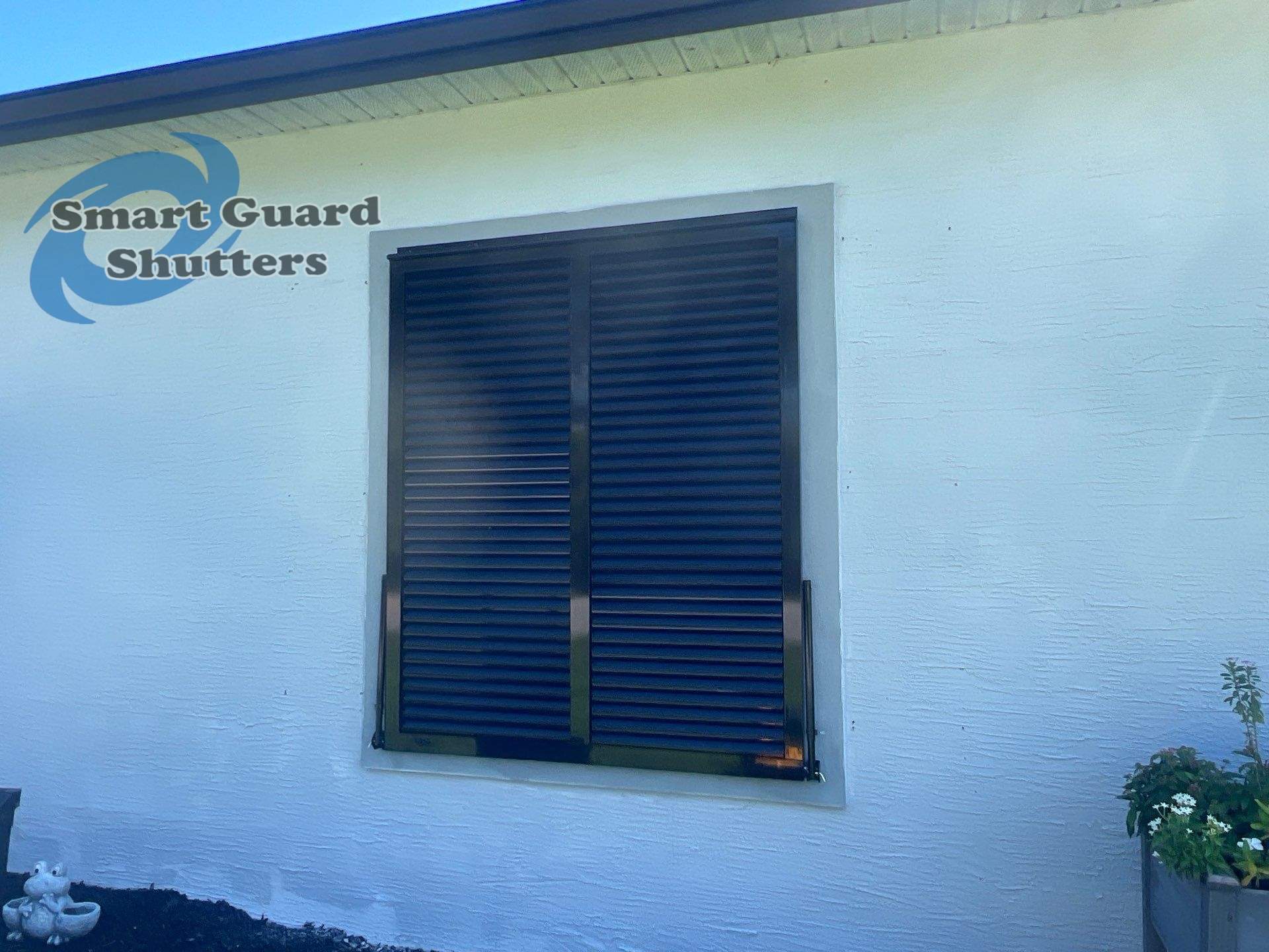 Impact Bahama Shutters in Jet Black by Smart Guard Shutters