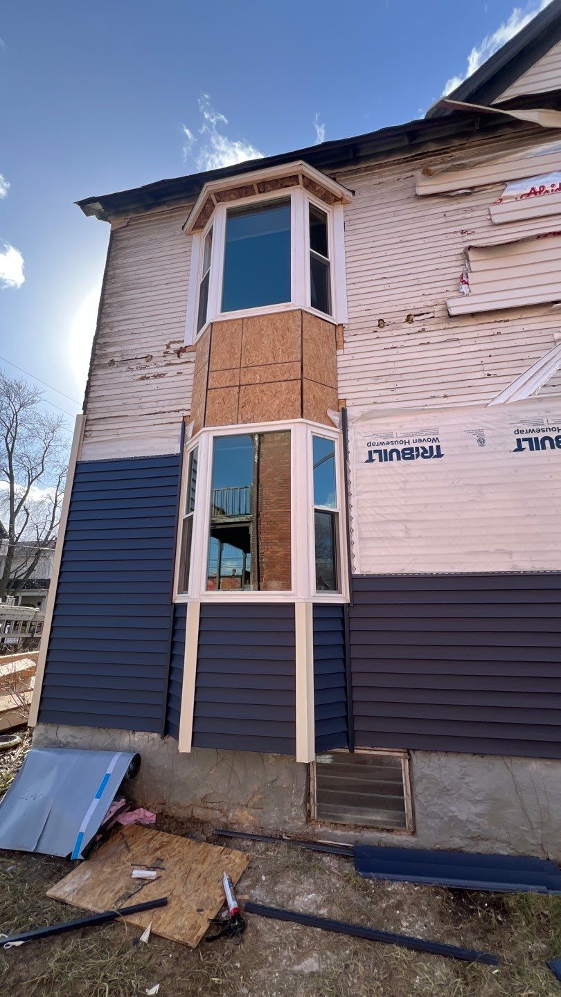 Adding Windows and installing Siding by Know-A-Guy Roofing & Exteriors