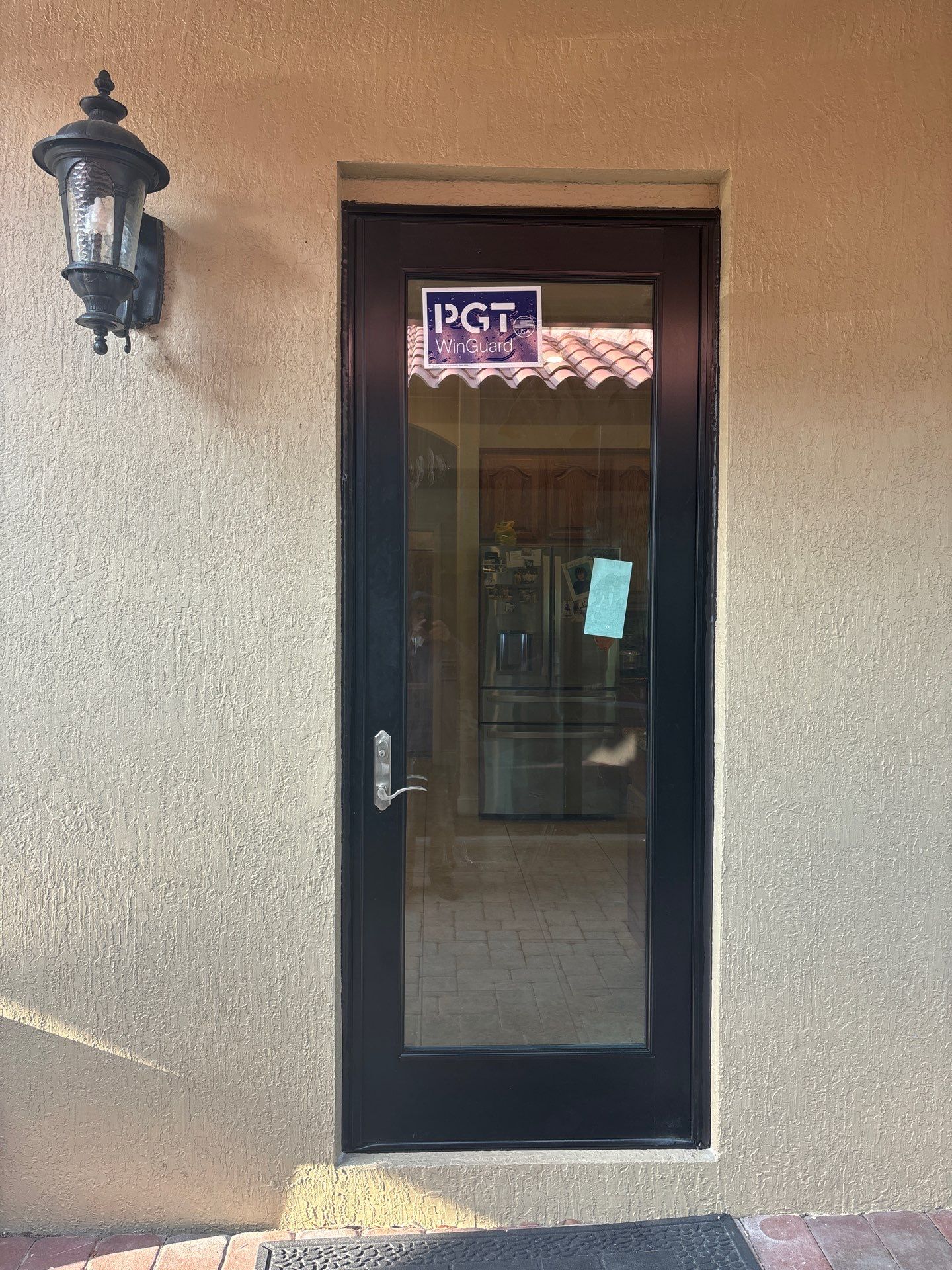 PGT Black pocket doors and Euro-Wall storefront & SGD by Windows For Life 