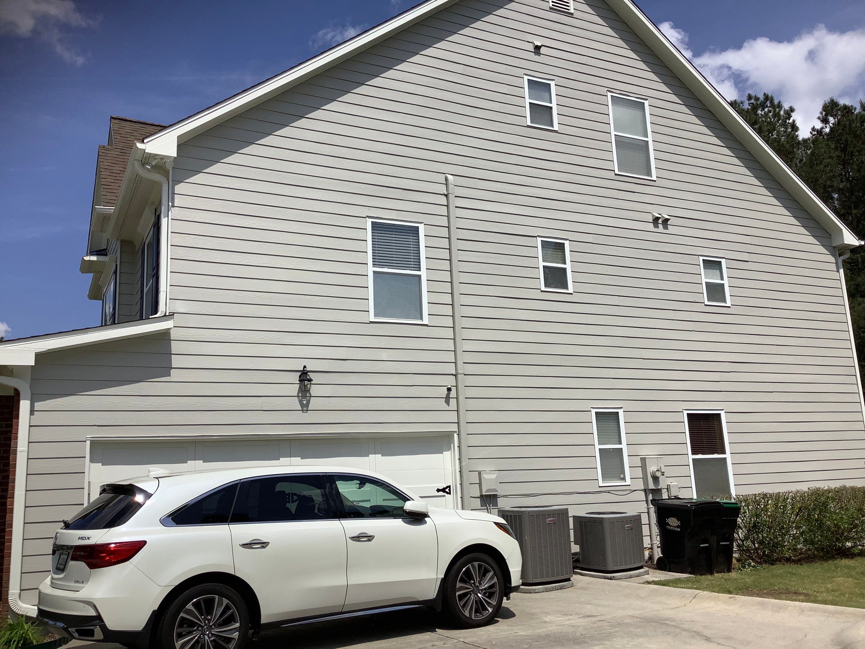 Exterior Home Refresh in Powder Springs with Gray Siding and White Trim by Swift Home Renovations