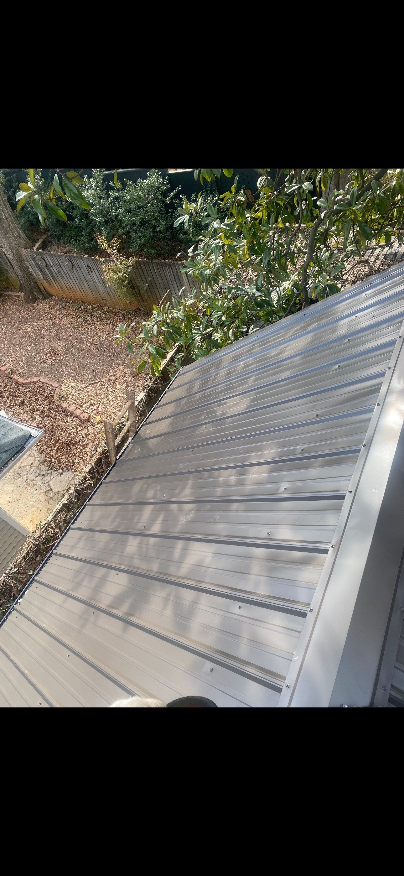 metal roof install by Nailed It Roofing & Remodeling LLC