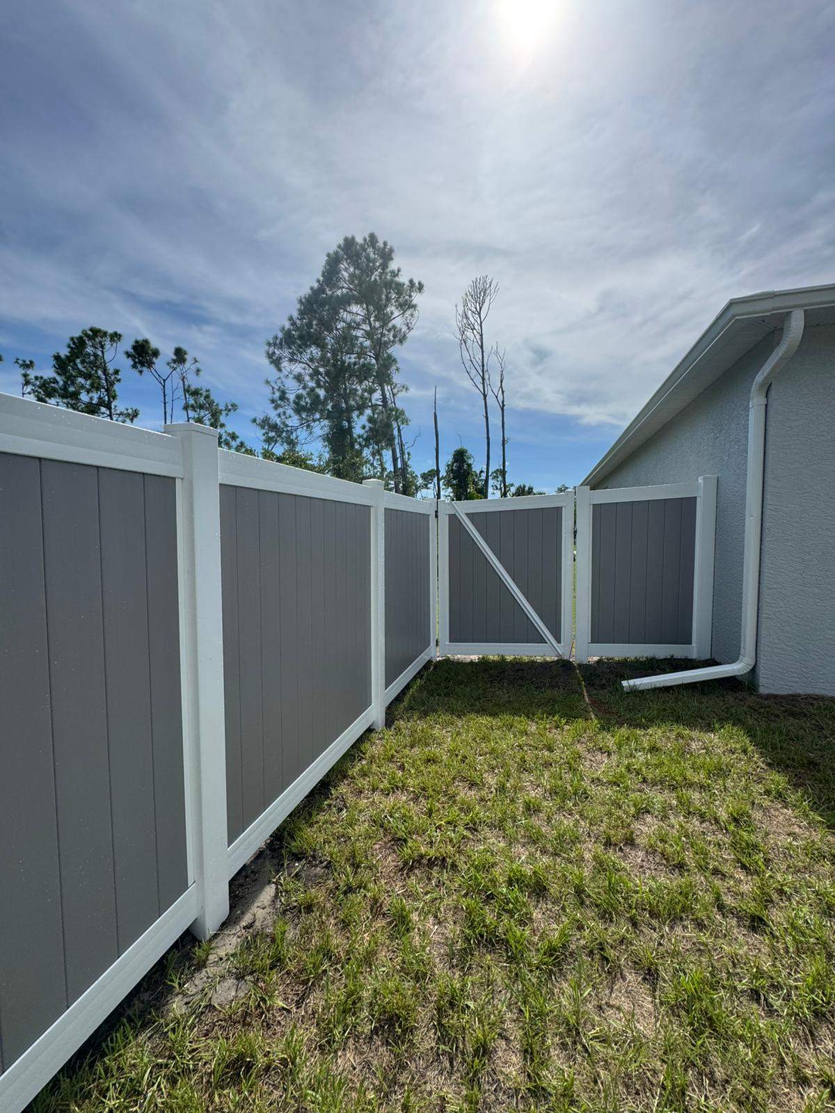 Two-Tone Vinyl Privacy Fence Installation in Port Charlotte by True Fence LLC