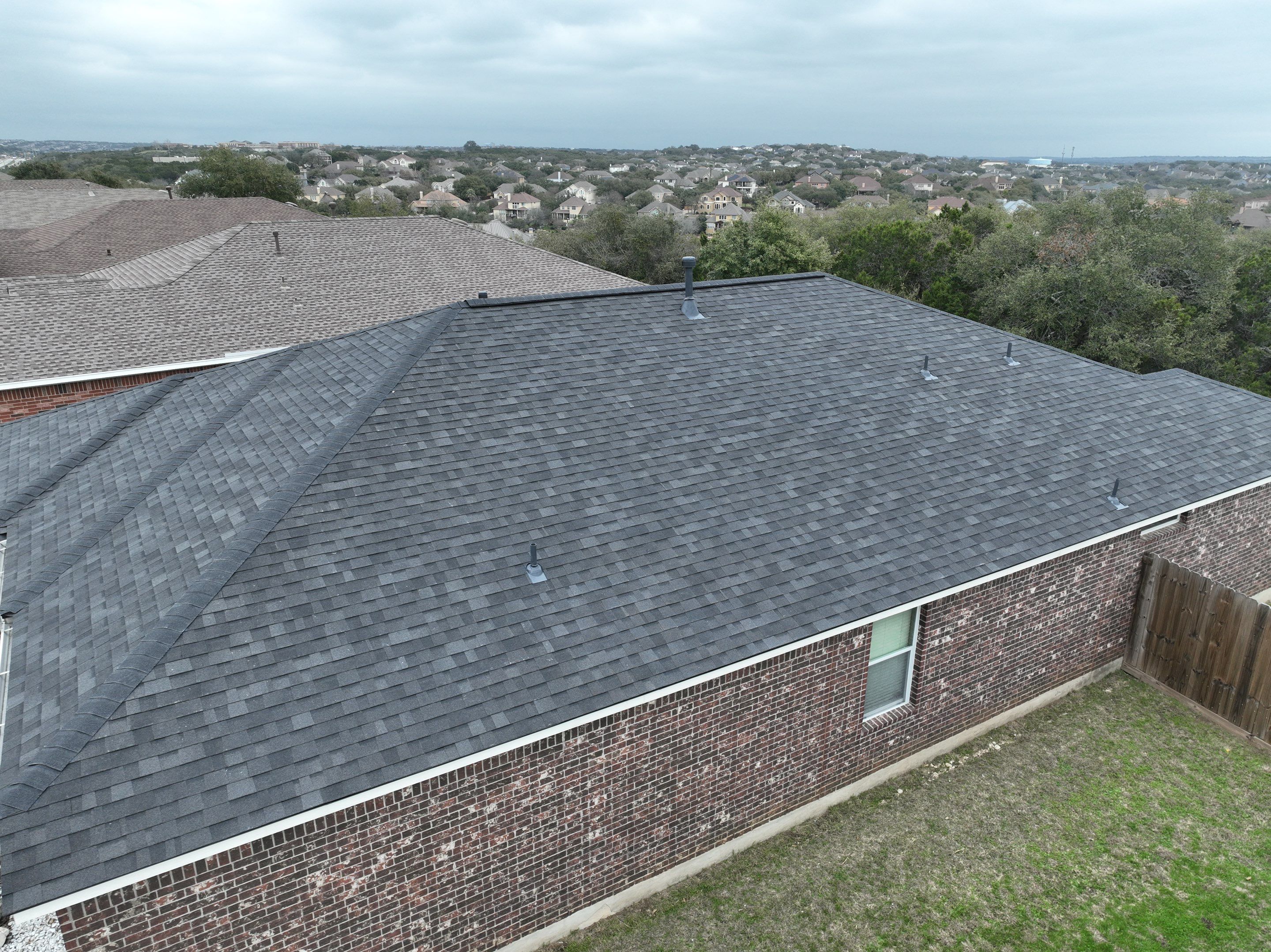 Residential Roof Replacement using 30 Year Laminate Shingles with High Profile Ridge by Premier Roofing and Contracting