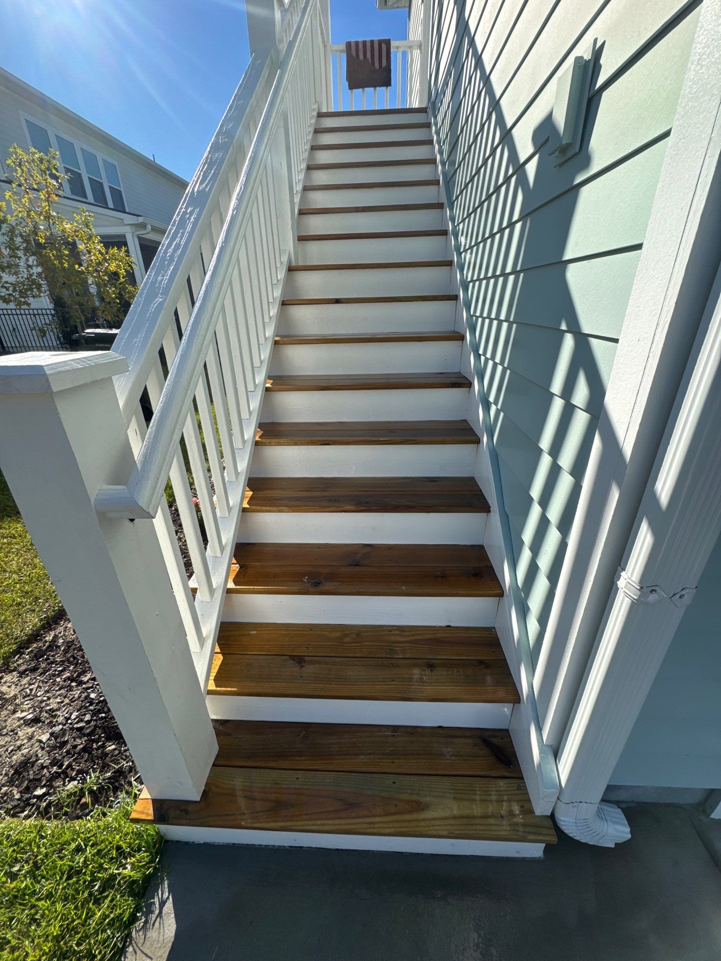 Weathered Deck and Concrete using Wood and Concrete Sealant by DuraSeal