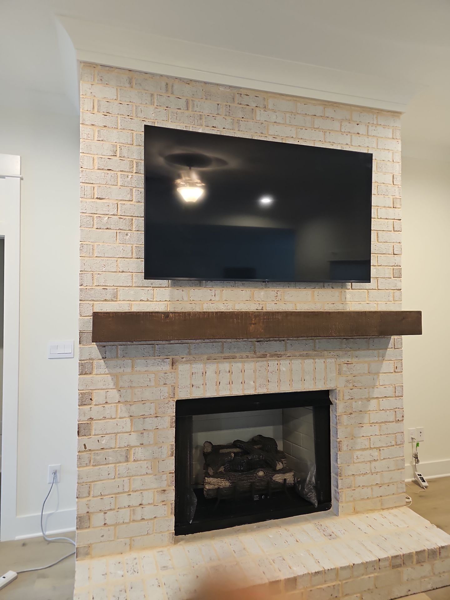 Fireplace TV Mounting Projects by Hangman Mounting & Installation 