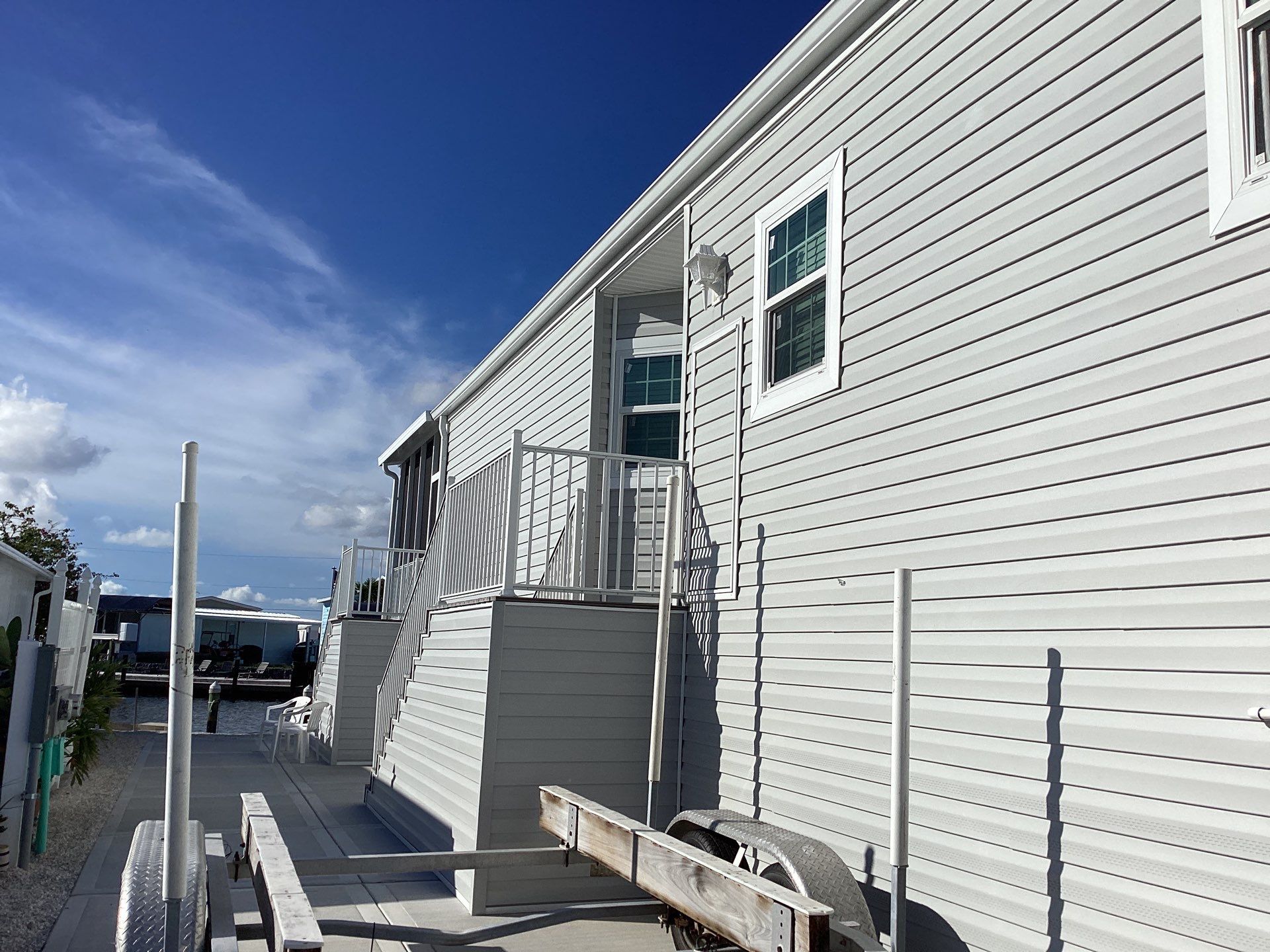 White Downspouts Installation in St. James City by Gutter Professors