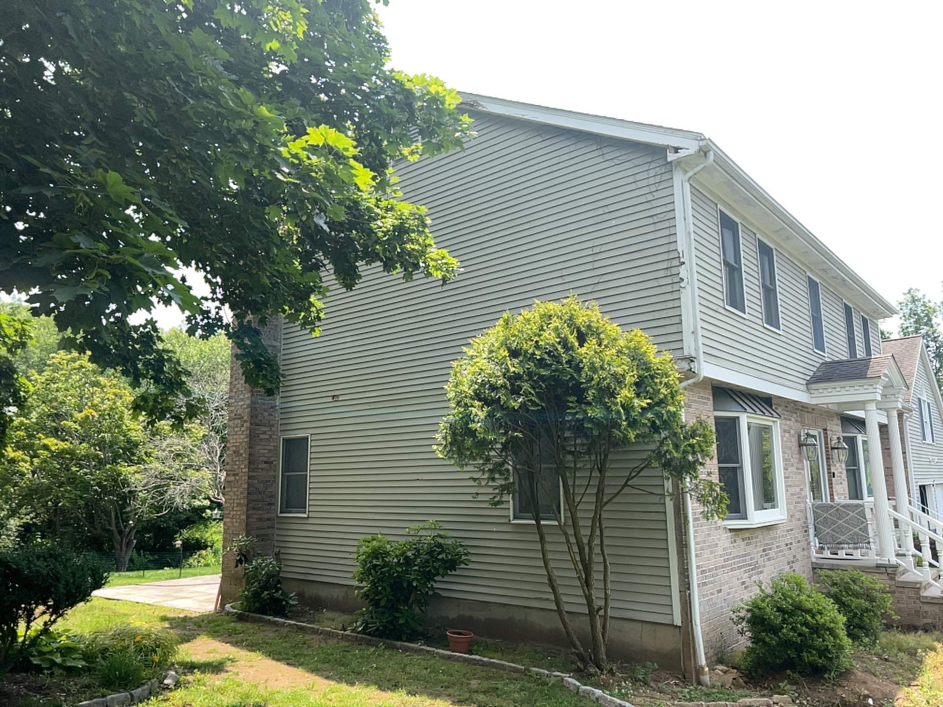 Siding Installation using Mainstreet Colonial & White gutters by A Plus Exterior