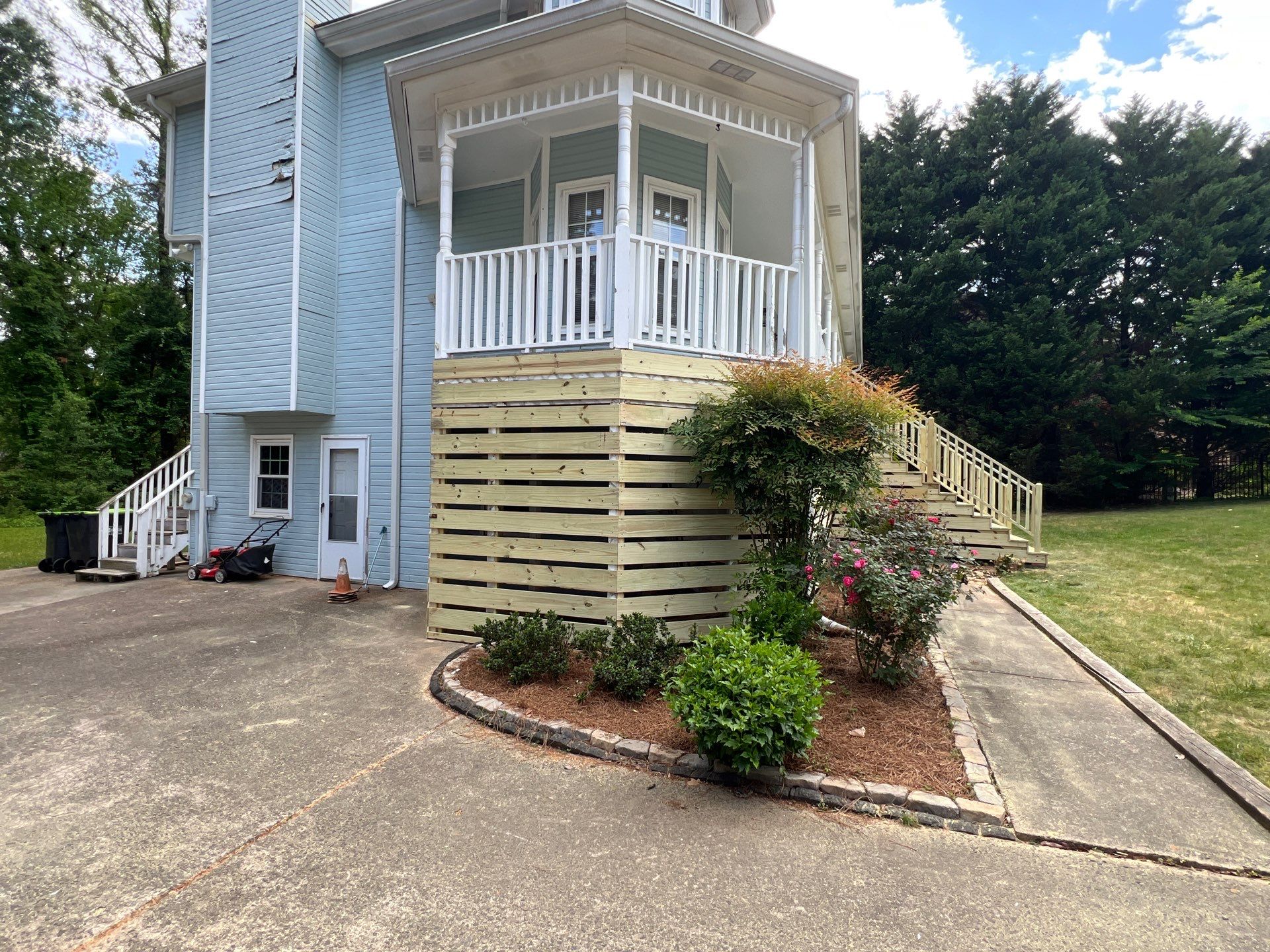 Marietta Porch Upgrade with Horizontal Pressure-Treated Wood Slats by Swift Home Renovations