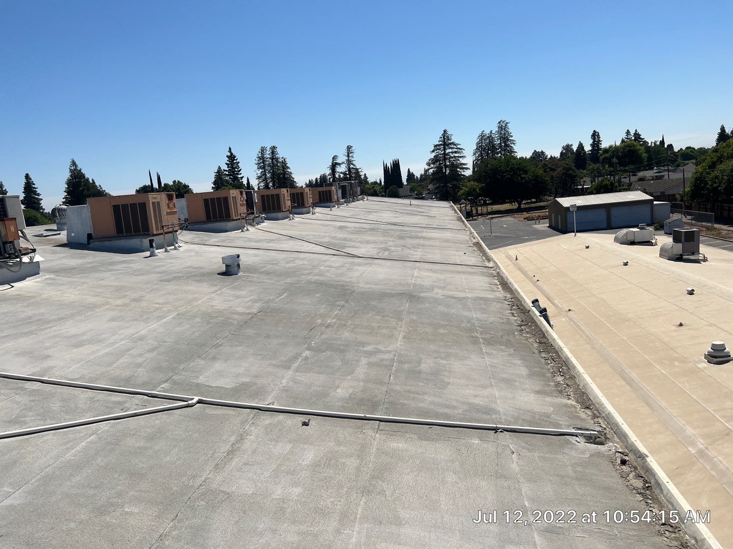 MR Roofing system using Benchmark/PUMA XL coatings over TPO single-ply roofing by Straight Edge Roofing Inc