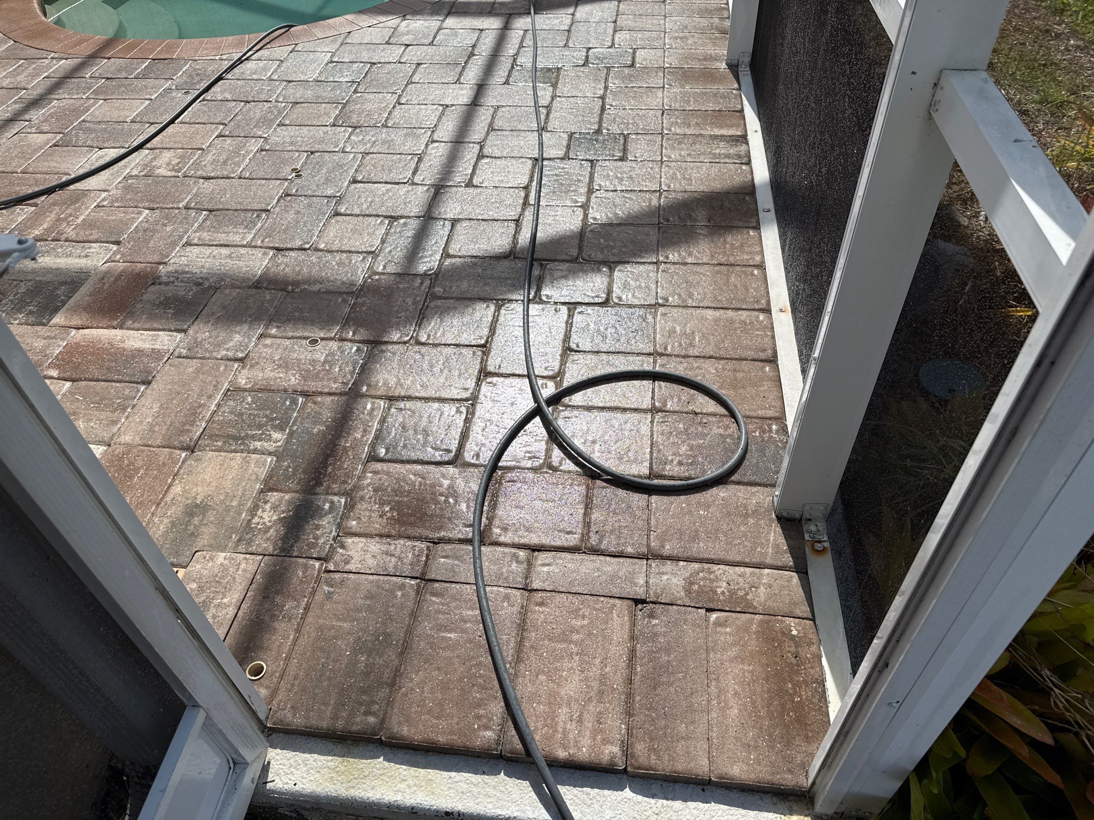 Paver Pool Deck & Screen Enclosure Transformation | University Park, Sarasota FL by Sunshine AquaWash