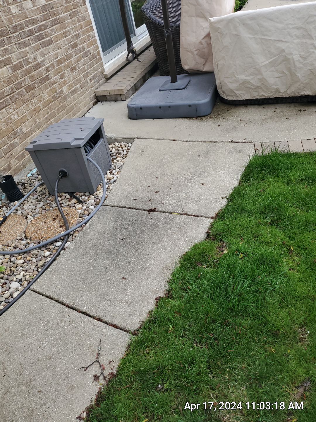 concrete patio and driveway cleaning by Northern Power Washing LLC.