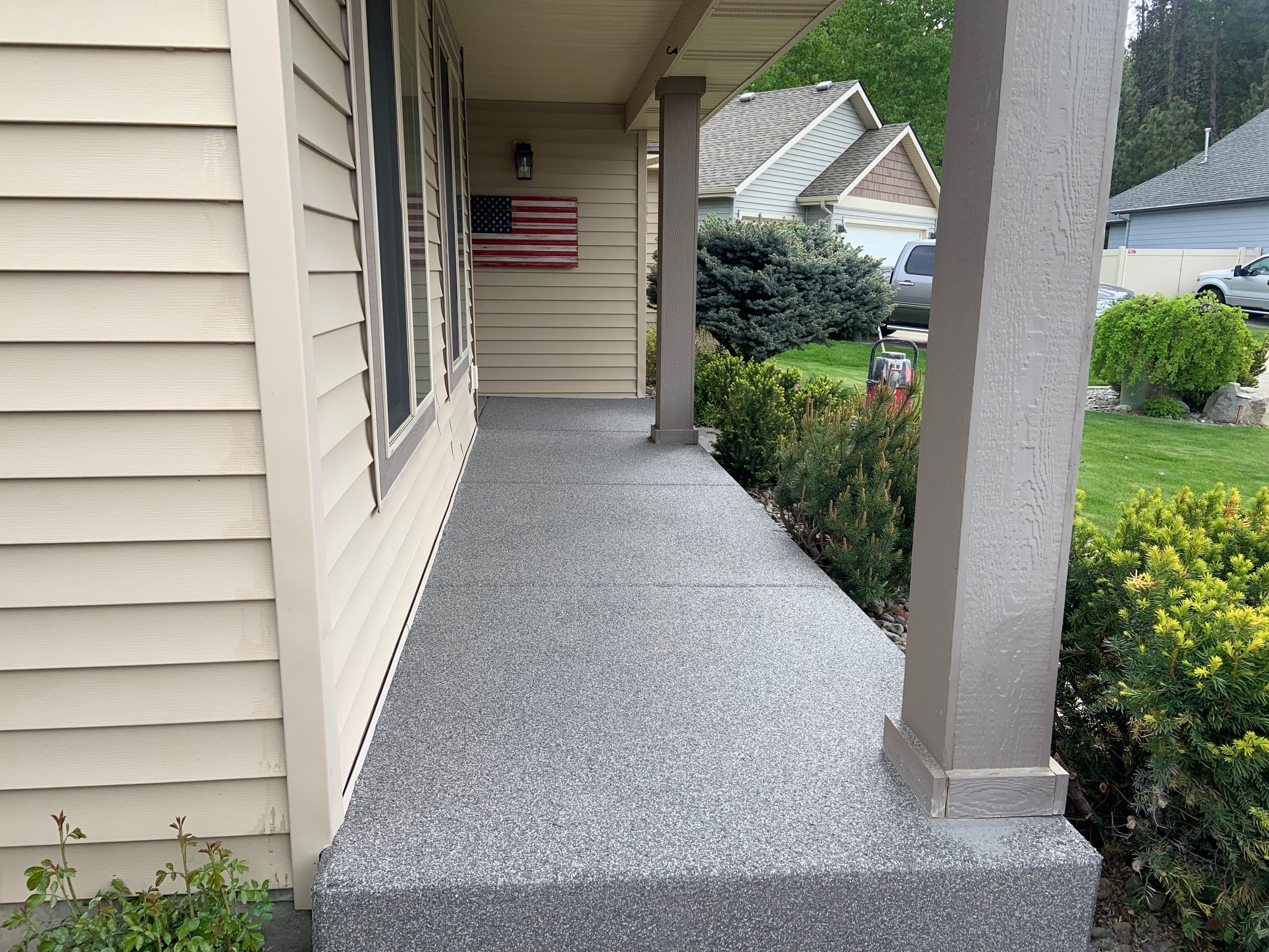Garage Transformation using Pebble Beach and Front Porch using Greystone by Croc Coatings, LLC