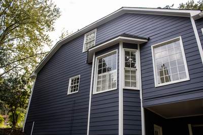 Blue Exterior Paint and Siding Installation using James Hardie Lap Siding