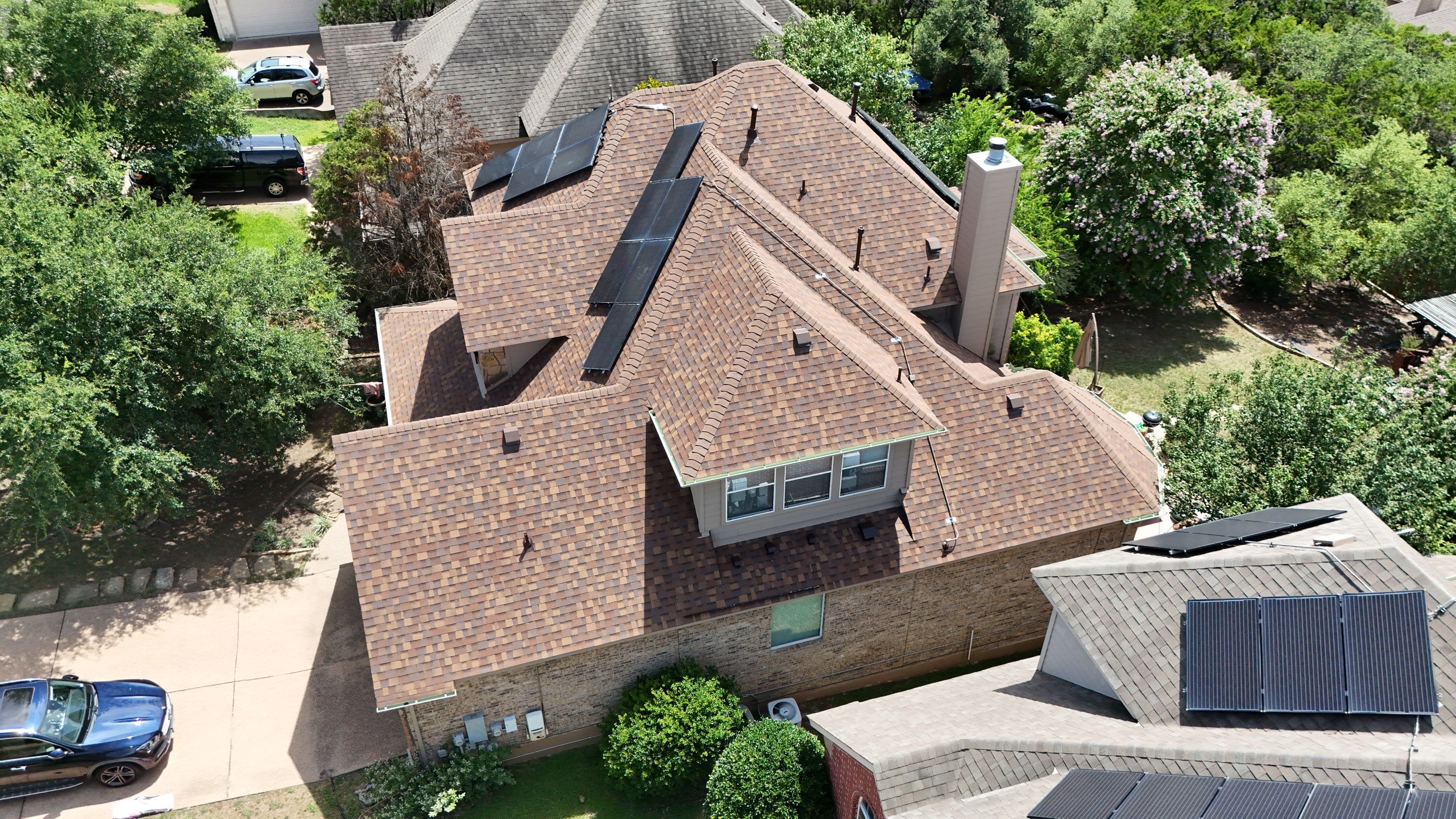 Residential Roof Replacement using Owens Corning - Duration - Desert Rose by Action Exteriors Austin