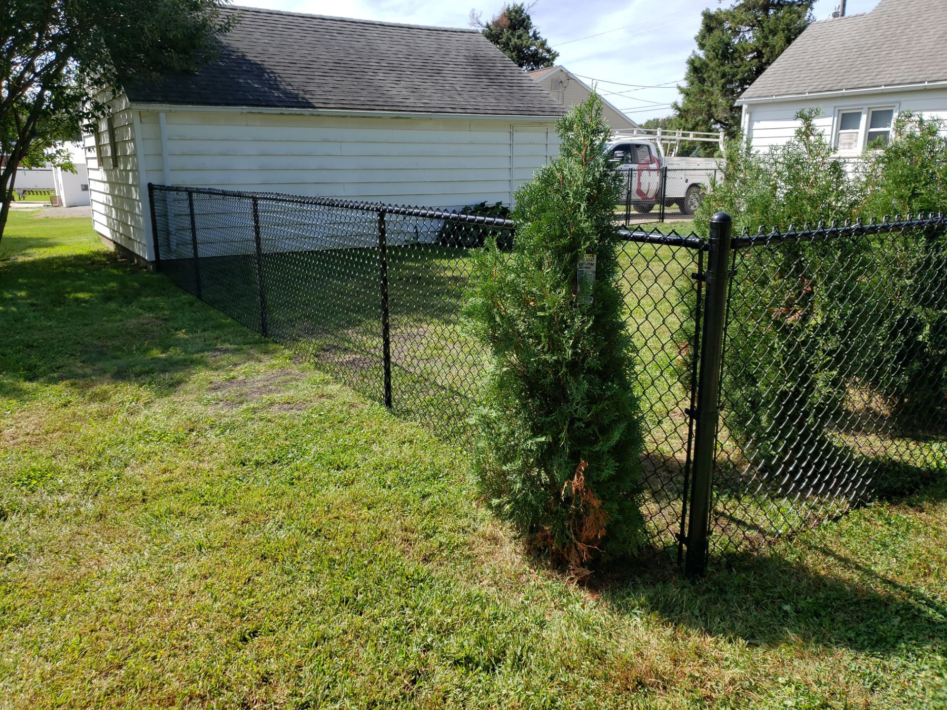 Residential Black Chain Link Fencing Project in Wellburg, Iowa by Perfect Picket Fence and Stain
