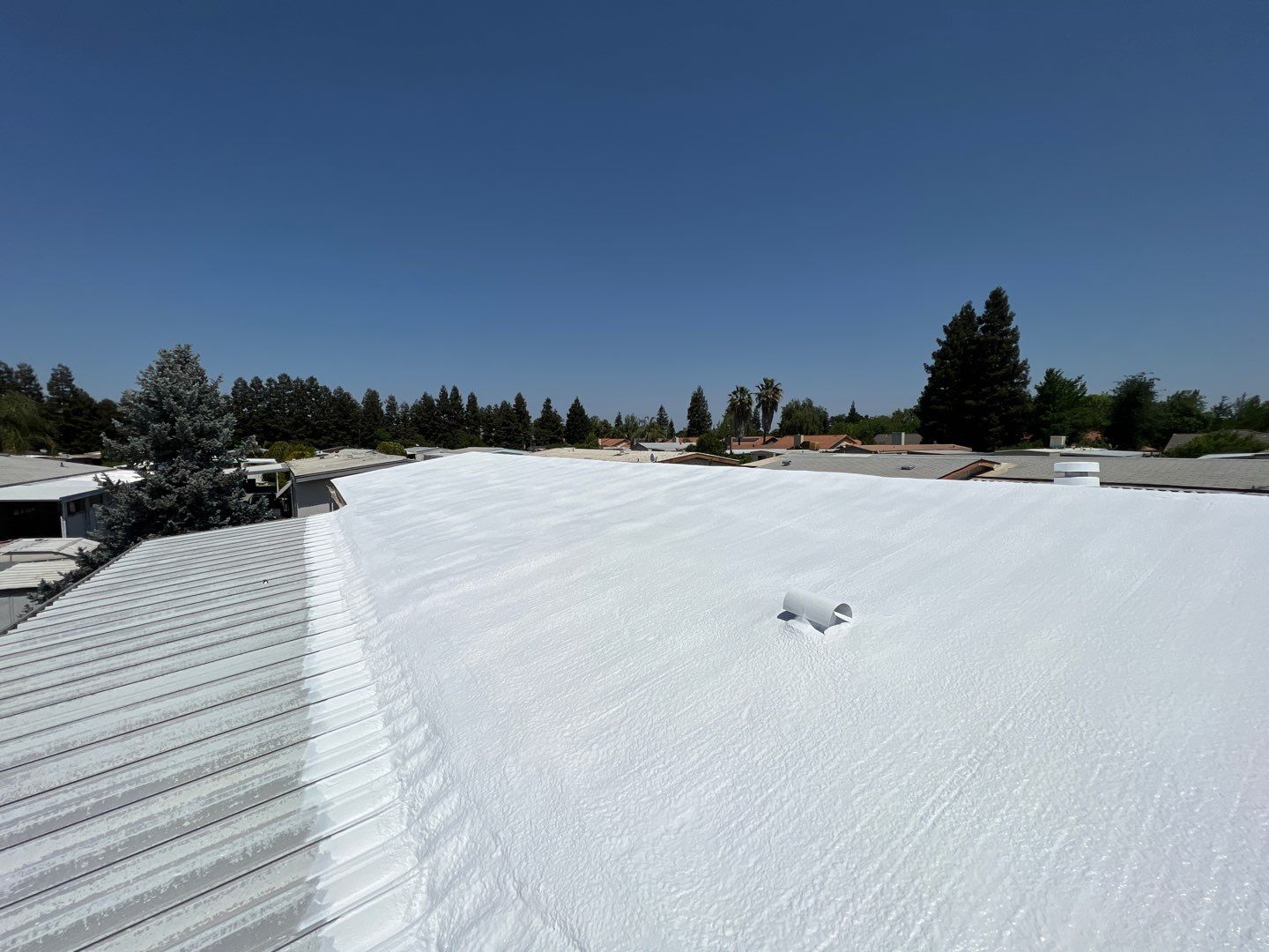 Spray foam and coatings using General Coatings acrylic coatings and spray foam by Straight Edge Roofing Inc