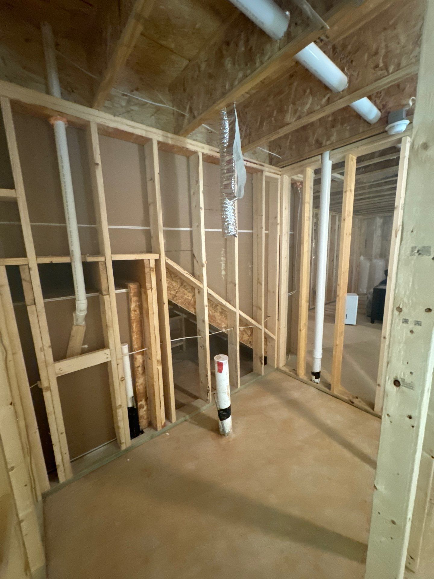 Finished Basement in Acworth Featuring a Full Bathroom and Bar by Swift Home Renovations