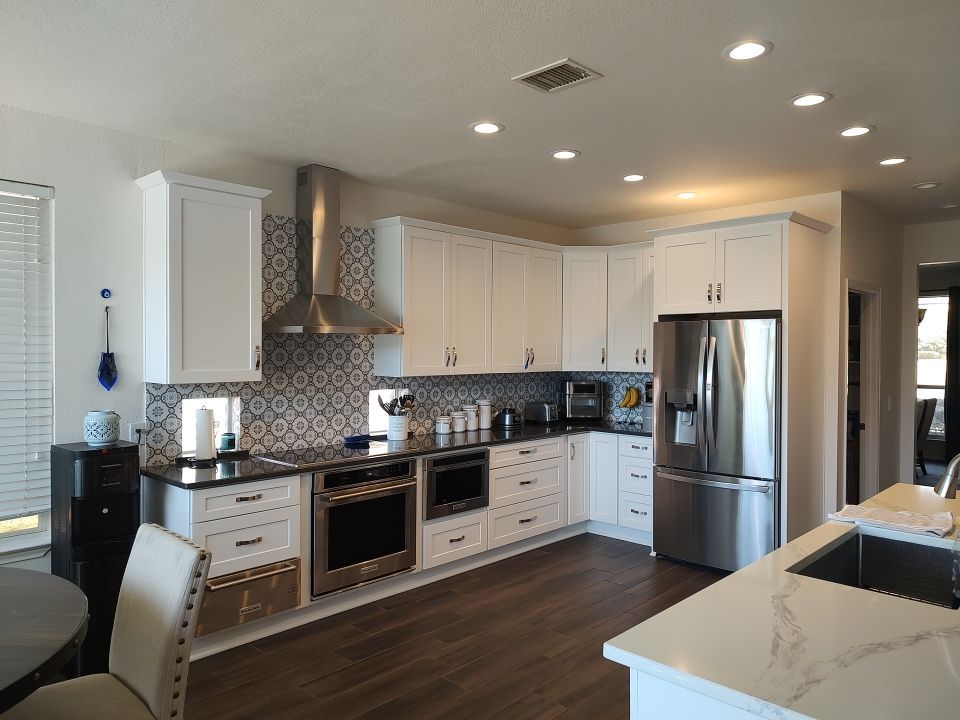 Stone Oak San Antonio Kitchen Remodel Featuring Custom White Cabinetry & Expanded Island by Legacy Bath and Kitchen 