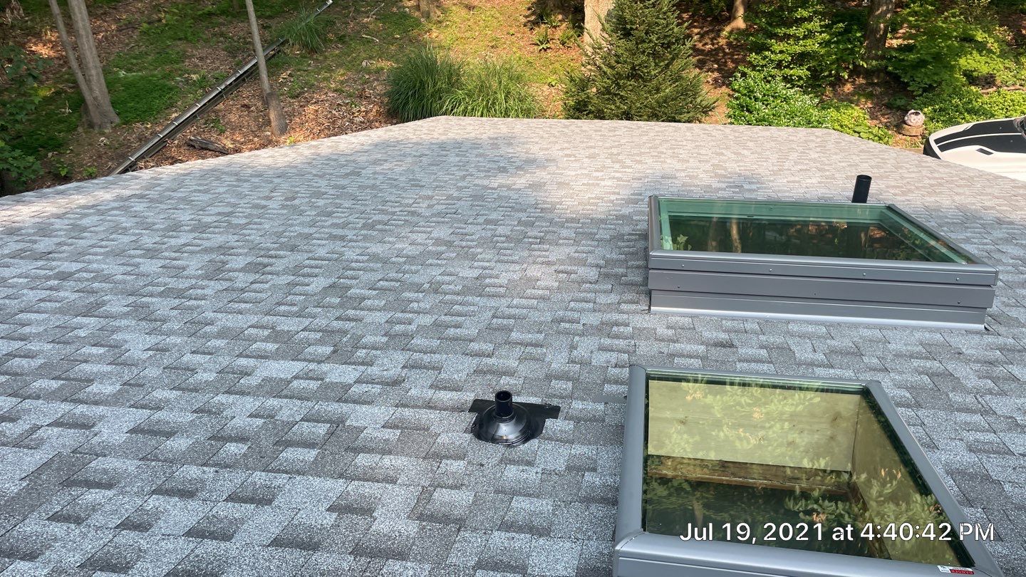 Deckhouse Roof Replacement by American Home Contractors