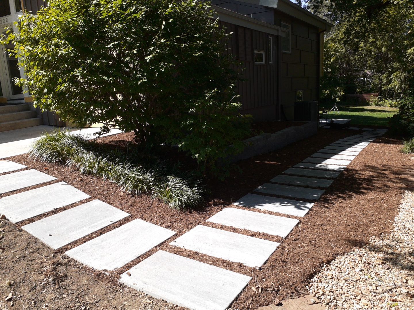 Back Yard Cantilivered Patio by LAND ESCAPES LLC