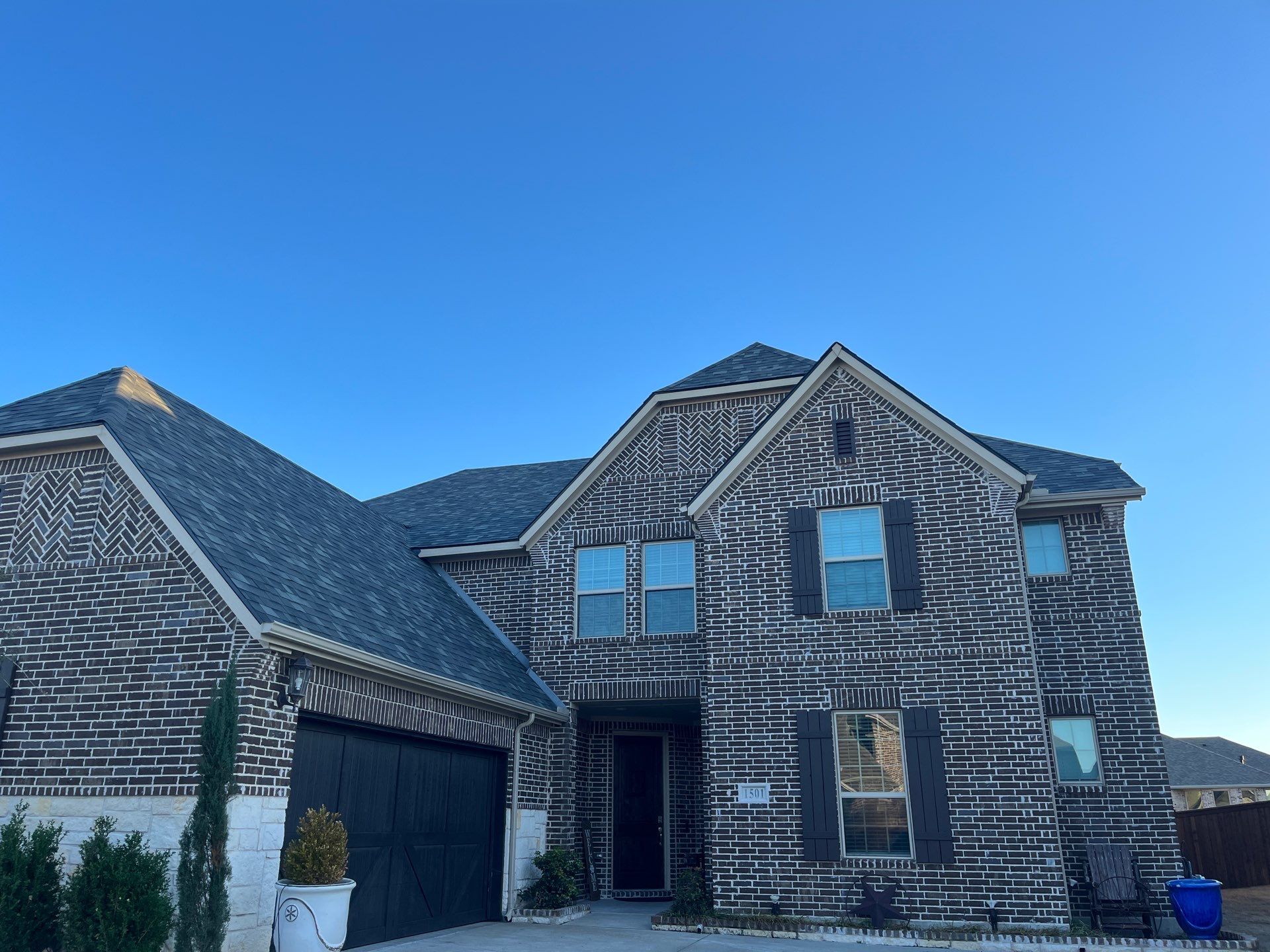 Red Brick with Malarkey Storm Grey by Tejas Roofworks + Restoration