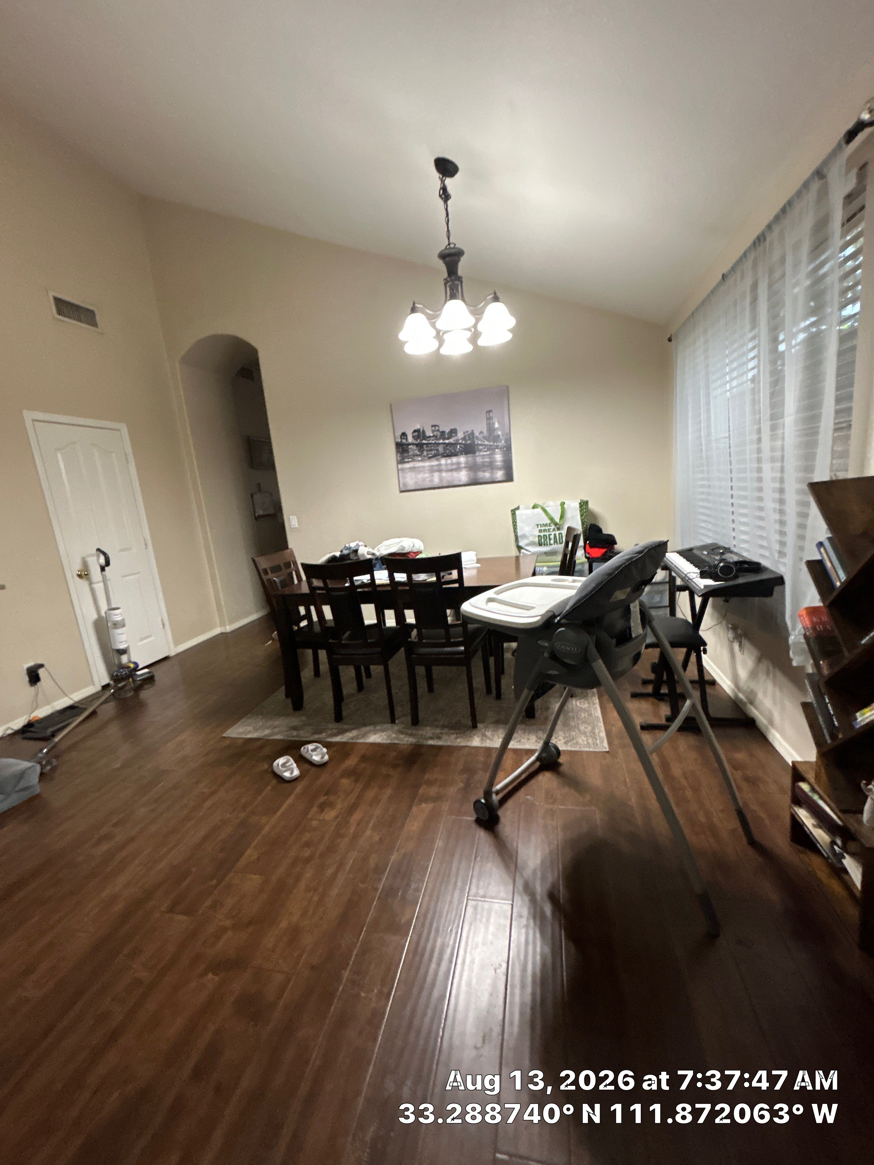 Dark Wood Laminate Flooring Installation in Chandler Dining Room by CompanyCam Sales Demo