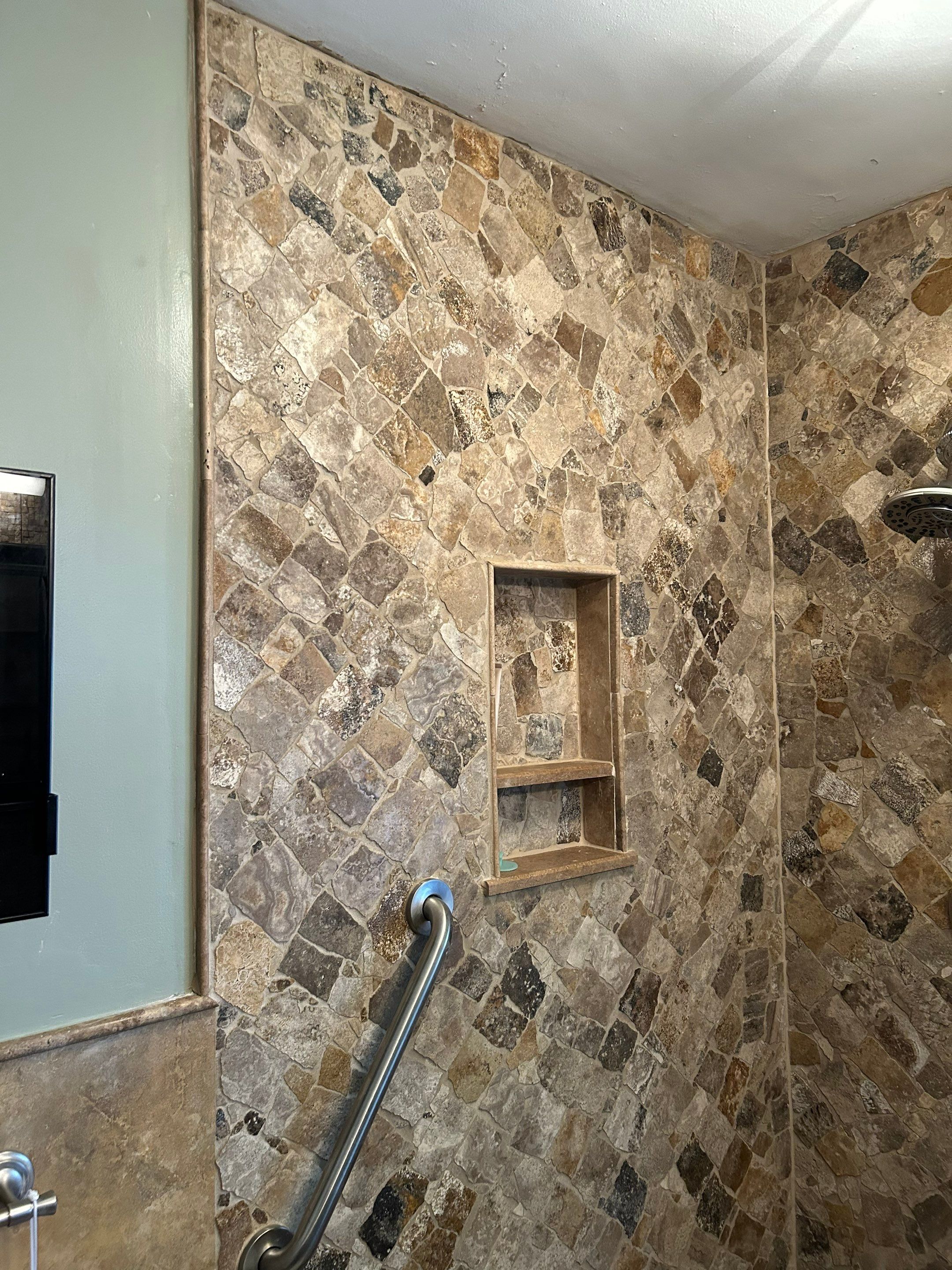 Natural Stone Shower Remodel and Pebble Floor Installation in Louisville by Footprints Floors Kentucky